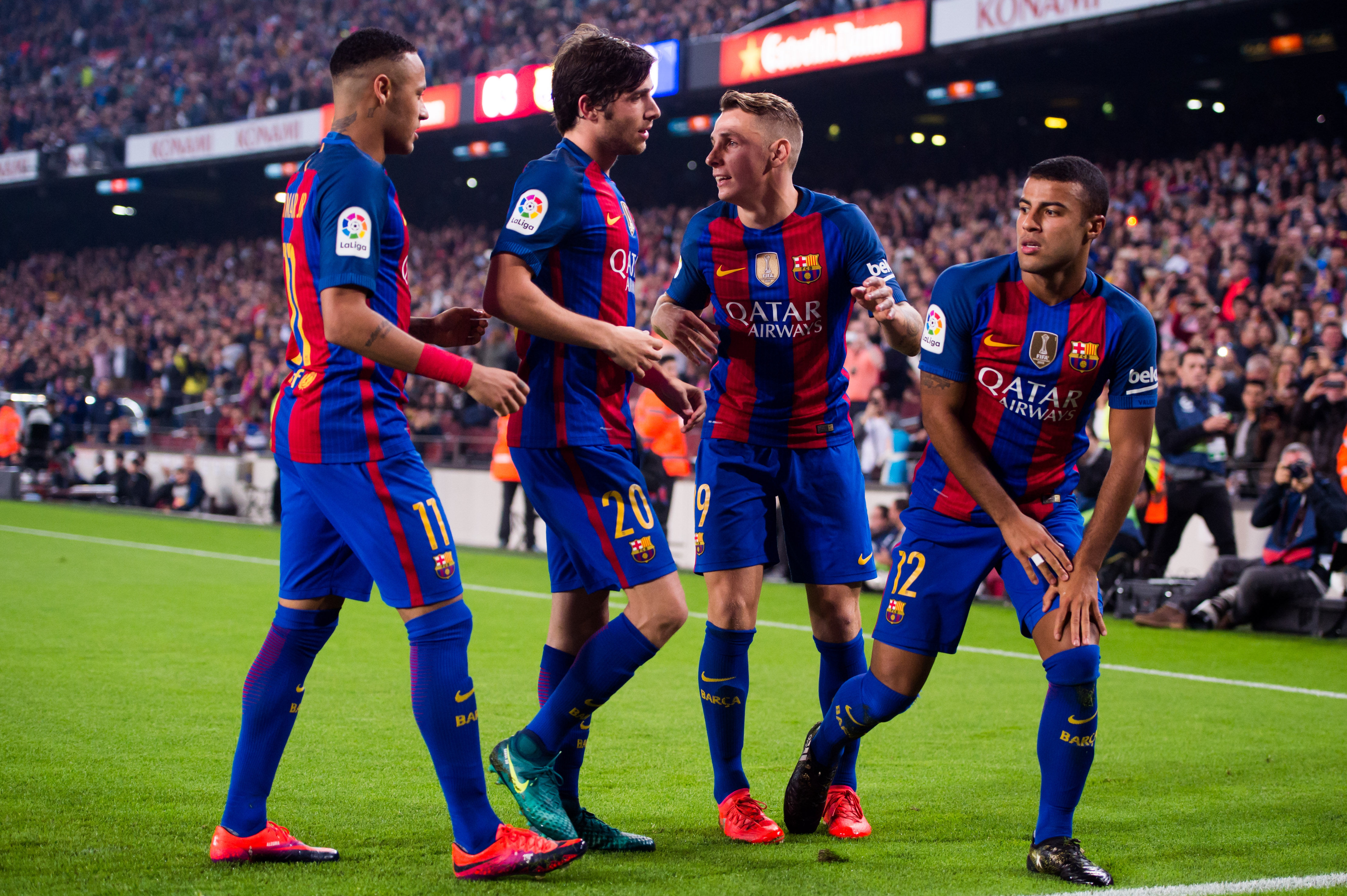BARCELONA, SPAIN - OCTOBER 29: Rafinha (R) of FC Barcelona celebrates with his teammates Neymar Santos Jr (L), Sergi Roberto (2nd L) and Lucas Digne (2nd R) after scoring the opening goal during the La Liga match between FC Barcelona and Granada CF at Camp Nou stadium on October 29, 2016 in Barcelona, Spain. (Photo by Alex Caparros/Getty Images)