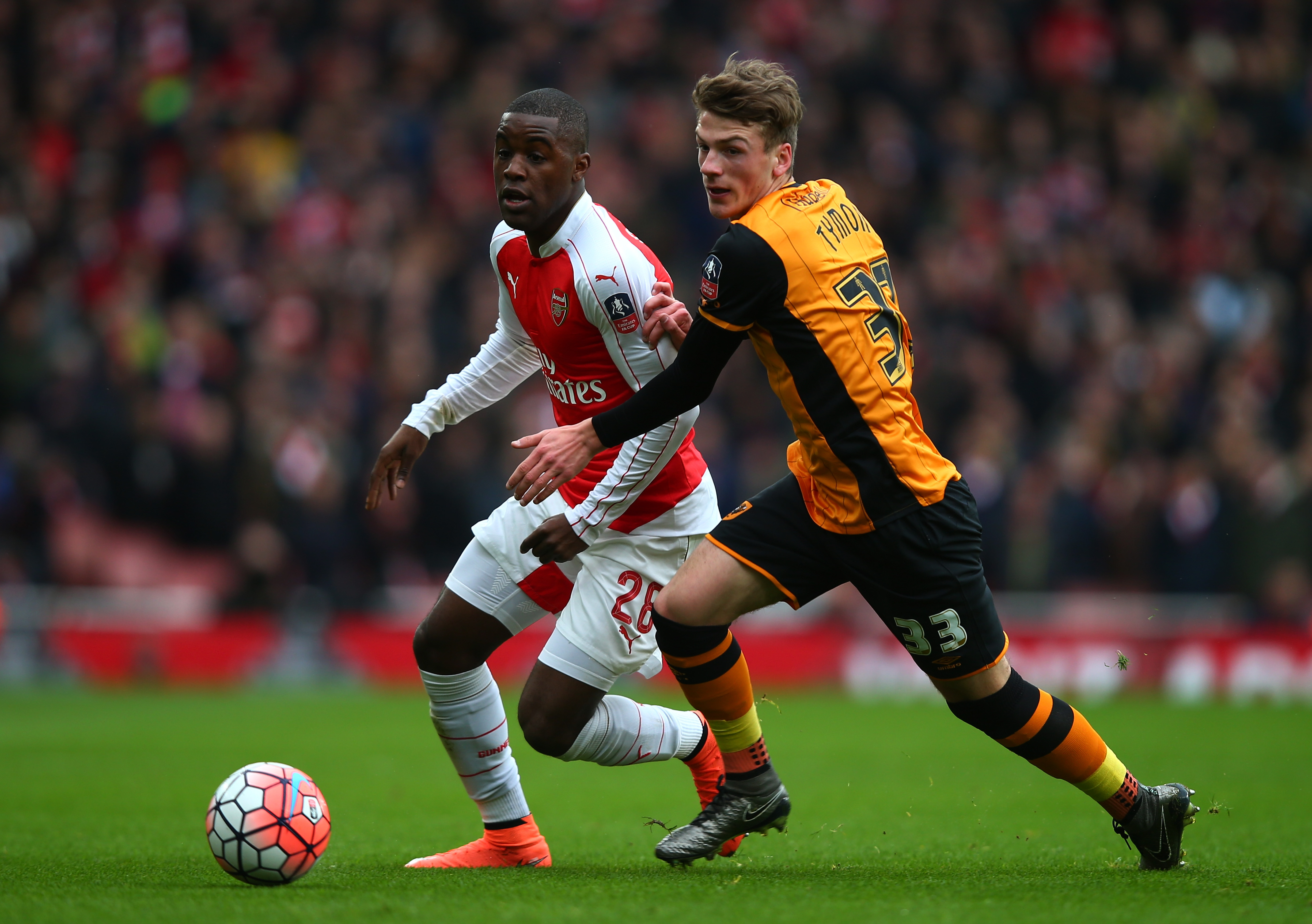 LONDON, ENGLAND - FEBRUARY 20:  Joel Campbell of Arsenal and Josh Tymon of Hull City compete for the ball during the Emirates FA Cup fifth round match between Arsenal and Hull City at the Emirates Stadium on February 20, 2016 in London, England.  (Photo by Clive Rose/Getty Images)