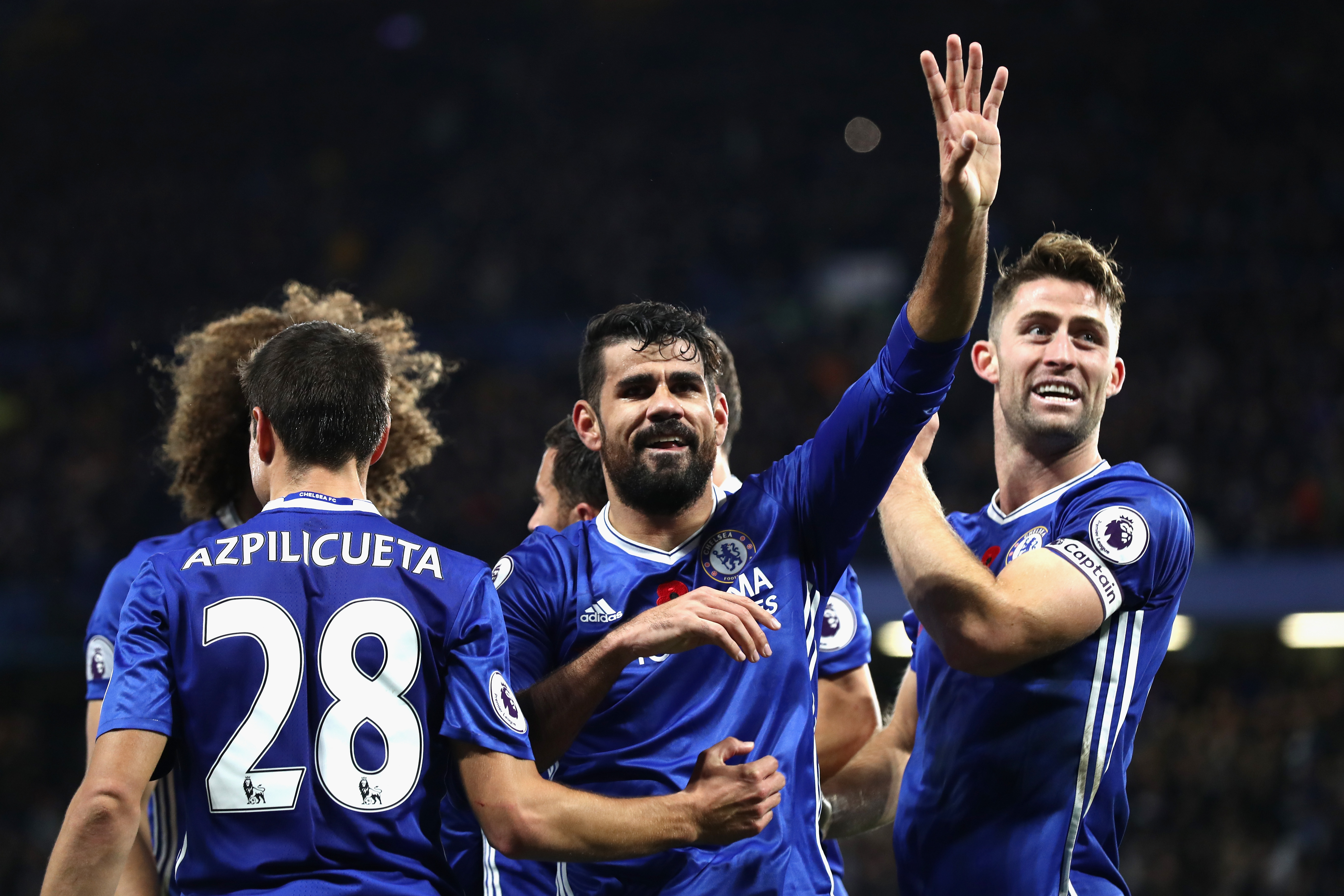 LONDON, ENGLAND - NOVEMBER 05: Diego Costa of Chelsea (C) celebrates scoring his sides third goal with his Chelsea team mates during the Premier League match between Chelsea and Everton at Stamford Bridge on November 5, 2016 in London, England.  (Photo by Clive Rose/Getty Images)