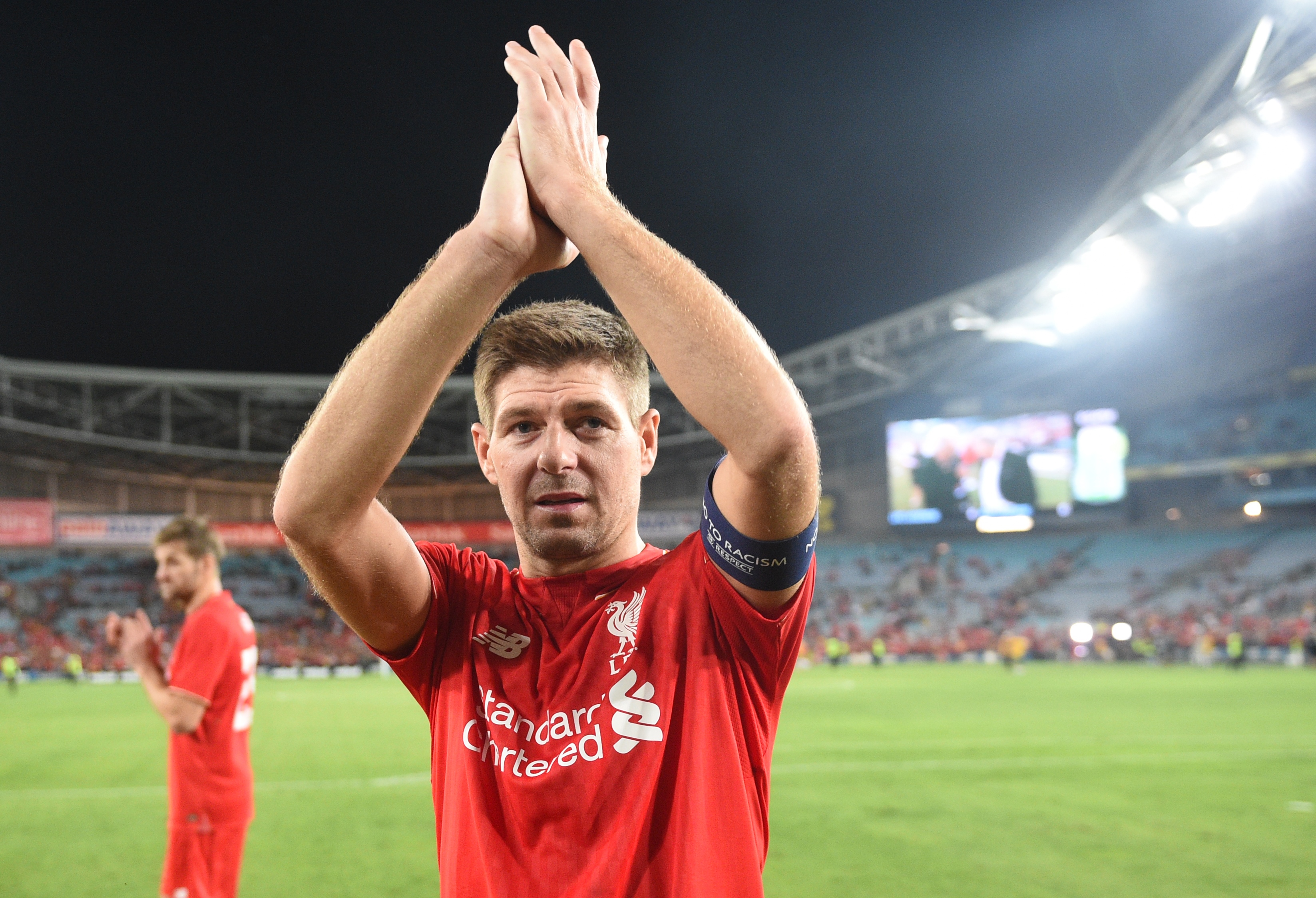 Former Liverpool football star Steven Gerrard applauds the fans after playing for Liverpool Legends against Australian Legends in an exhibition football game at the ANZ Stadium in Sydney on January 7, 2016. AFP PHOTO / Peter PARKS    IMAGE STRICTLY FOR EDITORIAL USE - STRICTLY NO COMMERCIAL USE / AFP / PETER PARKS        (Photo credit should read PETER PARKS/AFP/Getty Images)