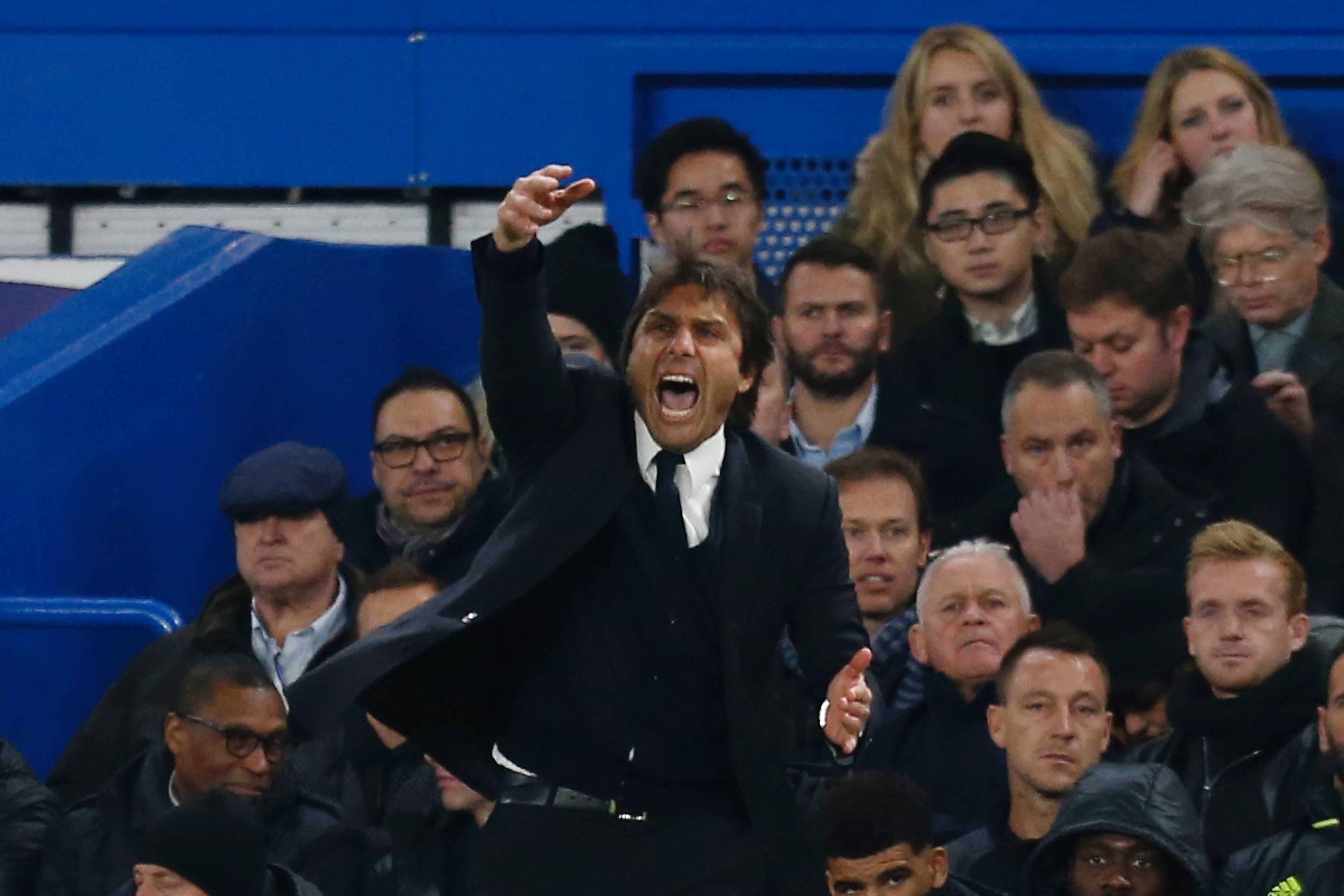 Chelsea's Italian head coach Antonio Conte gestures from the touchline during the English Premier League football match between Chelsea and Tottenham Hotspur at Stamford Bridge in London on November 26, 2016. / AFP / Ian KINGTON / RESTRICTED TO EDITORIAL USE. No use with unauthorized audio, video, data, fixture lists, club/league logos or 'live' services. Online in-match use limited to 75 images, no video emulation. No use in betting, games or single club/league/player publications.  /         (Photo credit should read IAN KINGTON/AFP/Getty Images)