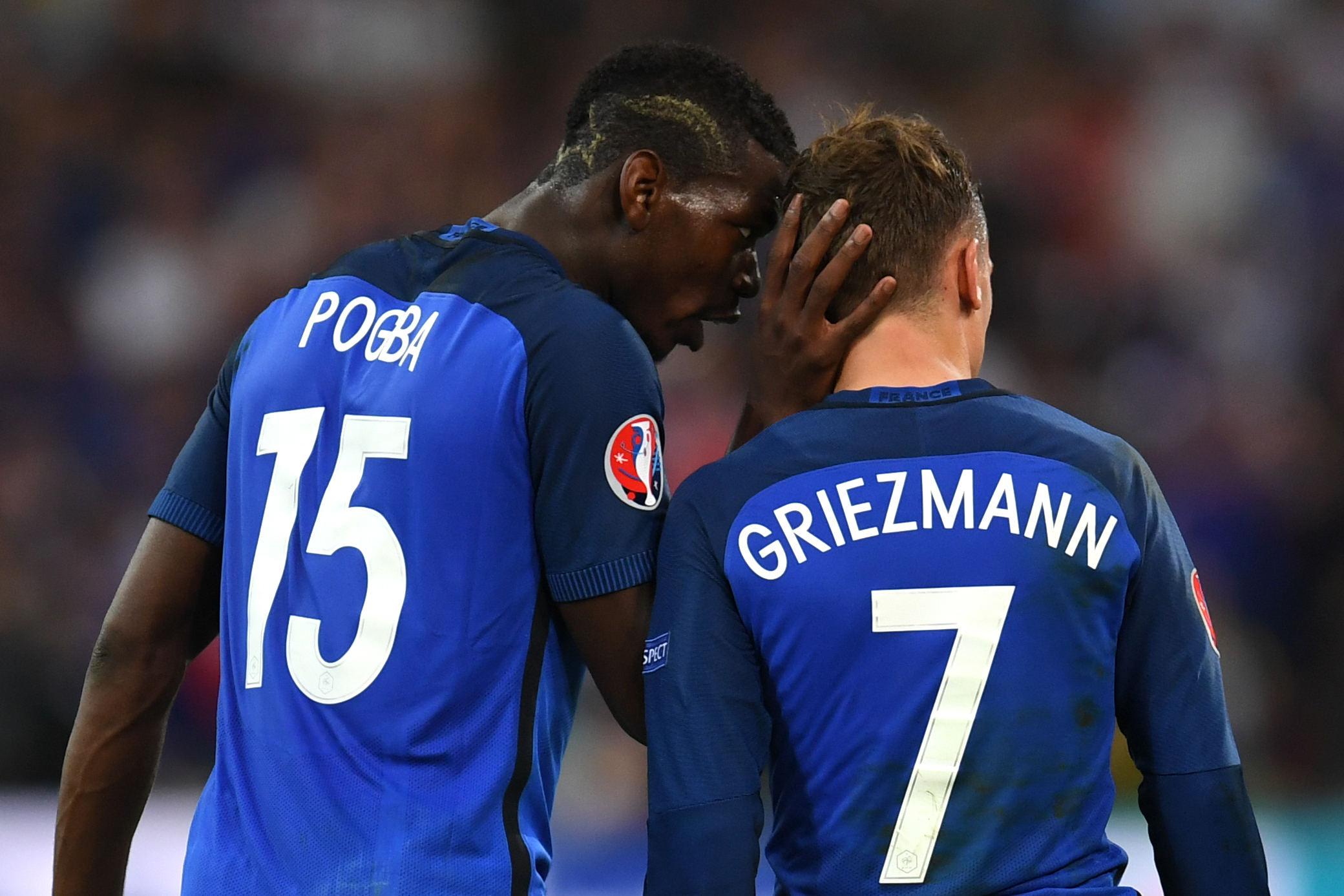 France's midfielder Paul Pogba (L) celebrates with France's forward Antoine Griezmann who scored a penalty shot giving France the first goal of the match during the Euro 2016 semi-final football match between Germany and France at the Stade Velodrome in Marseille on July 7, 2016.
 / AFP / PATRIK STOLLARZ        (Photo credit should read PATRIK STOLLARZ/AFP/Getty Images)