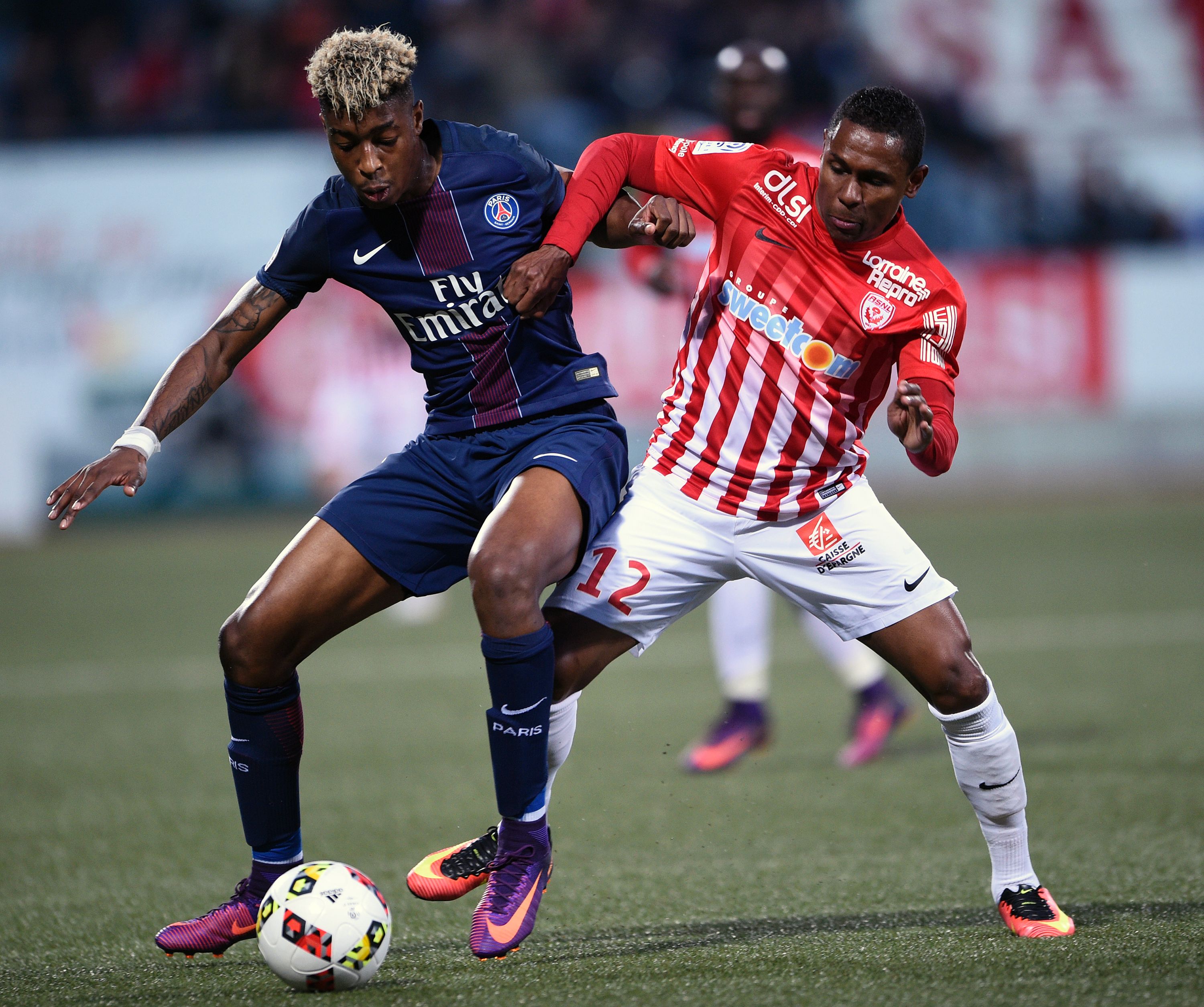 Nancy's French forward Christophe Mandanne (R) vies for the ball with Paris Saint-Germain's French defender Presnel Kimpembe during the French L1 football match between Nancy (ASNL) and Paris (PSG) on October 15, 2016, at Marcel Picot stadium in Tomblaine, eastern France. / AFP / JEAN-CHRISTOPHE VERHAEGEN        (Photo credit should read JEAN-CHRISTOPHE VERHAEGEN/AFP/Getty Images)