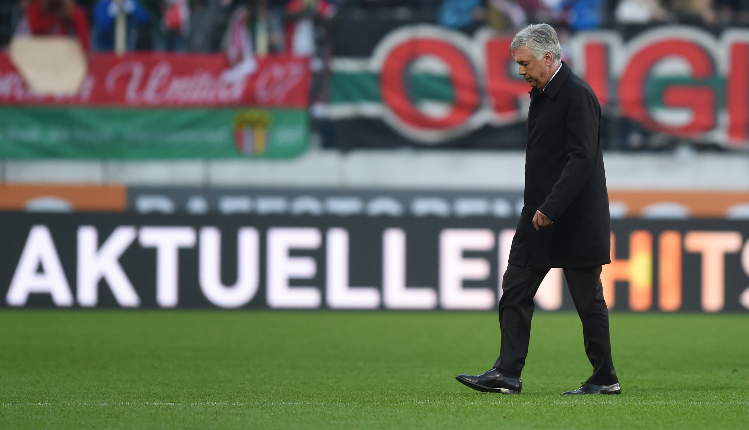 Bayern Munich's Italian headcoach Carlo Ancelotti leaves the stadium after the German first division Bundesliga football match between FC Augsburg and FC Bayern Munich in Augsburg, southern Germany, on October 29, 2016. / AFP / CHRISTOF STACHE / RESTRICTIONS: DURING MATCH TIME: DFL RULES TO LIMIT THE ONLINE USAGE TO 15 PICTURES PER MATCH AND FORBID IMAGE SEQUENCES TO SIMULATE VIDEO. == RESTRICTED TO EDITORIAL USE == FOR FURTHER QUERIES PLEASE CONTACT DFL DIRECTLY AT + 49 69 650050
        (Photo credit should read CHRISTOF STACHE/AFP/Getty Images)