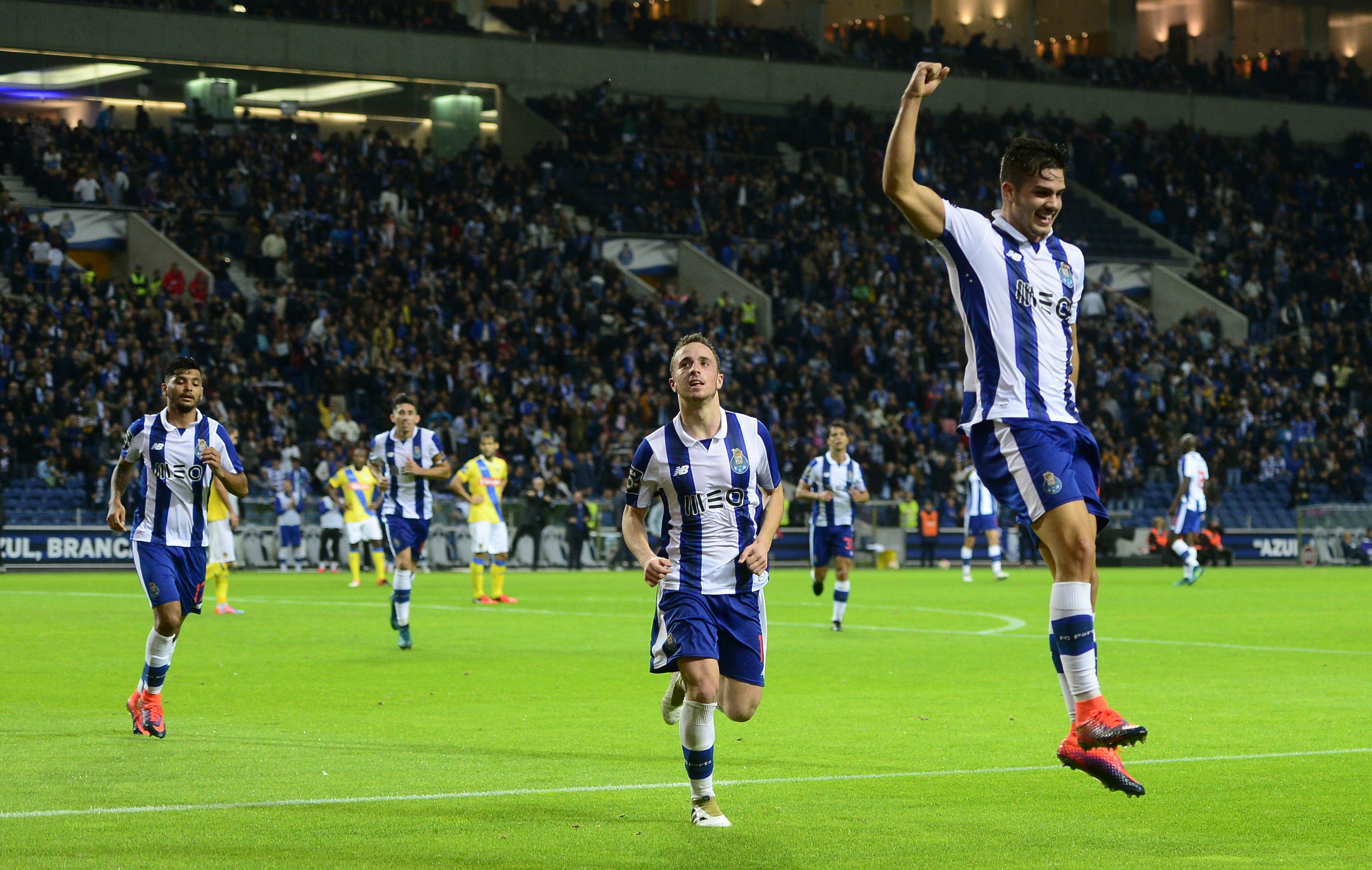 Porto's midfielder Andre Silva (R) celebrates after scoring a goal during the Portuguese league football match FC Porto vs FC Arouca at the Dragao stadium in Porto on October 22, 2016. / AFP / MIGUEL RIOPA        (Photo credit should read MIGUEL RIOPA/AFP/Getty Images)