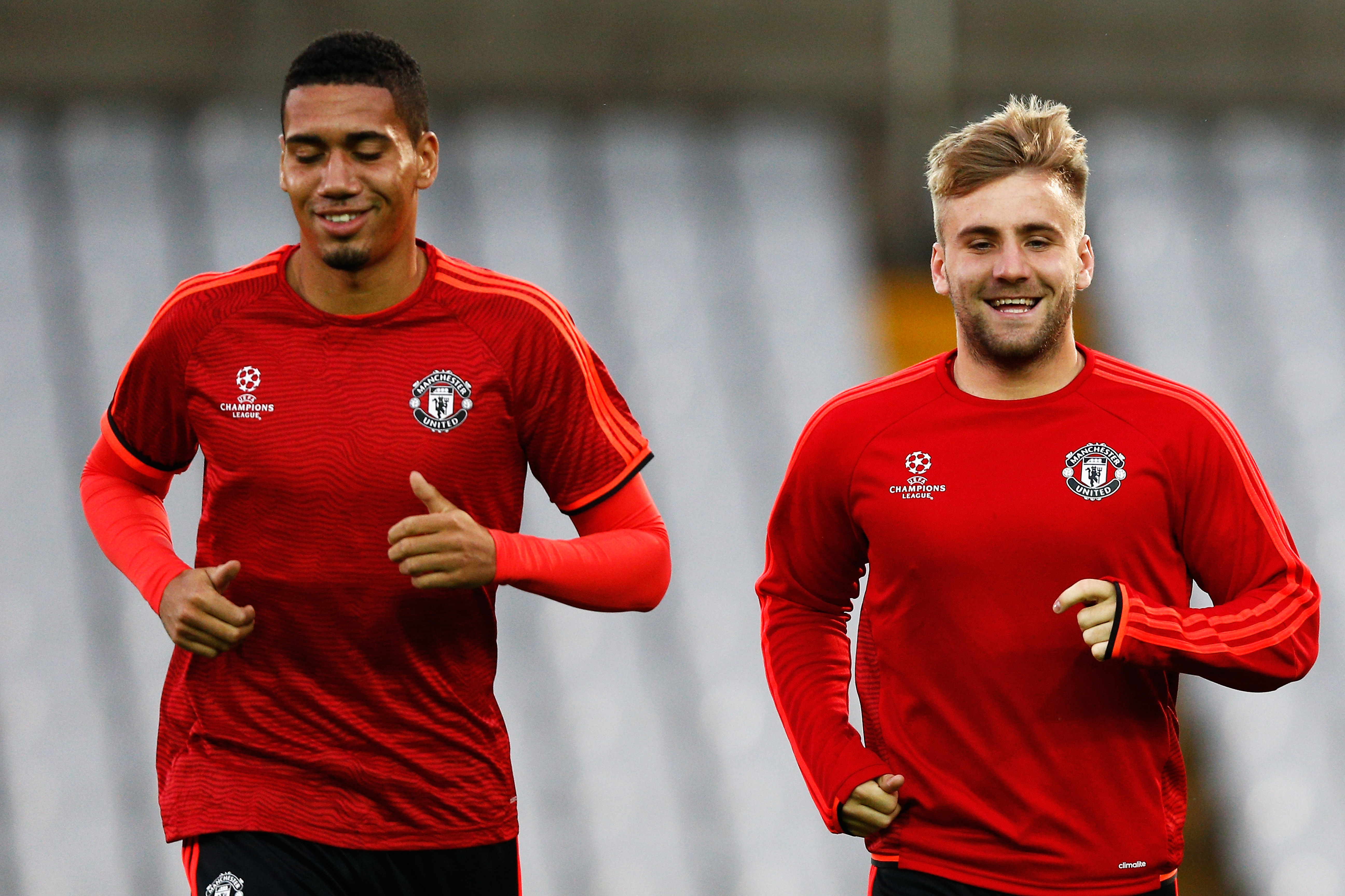 BRUGGE, BELGIUM - AUGUST 25:  Chris Smalling and Luke Shaw of Manchester United warm up during the Manchester United training session held at Jan Breydel Stadium on August 25, 2015 in Brugge, Belgium.  (Photo by Dean Mouhtaropoulos/Getty Images)