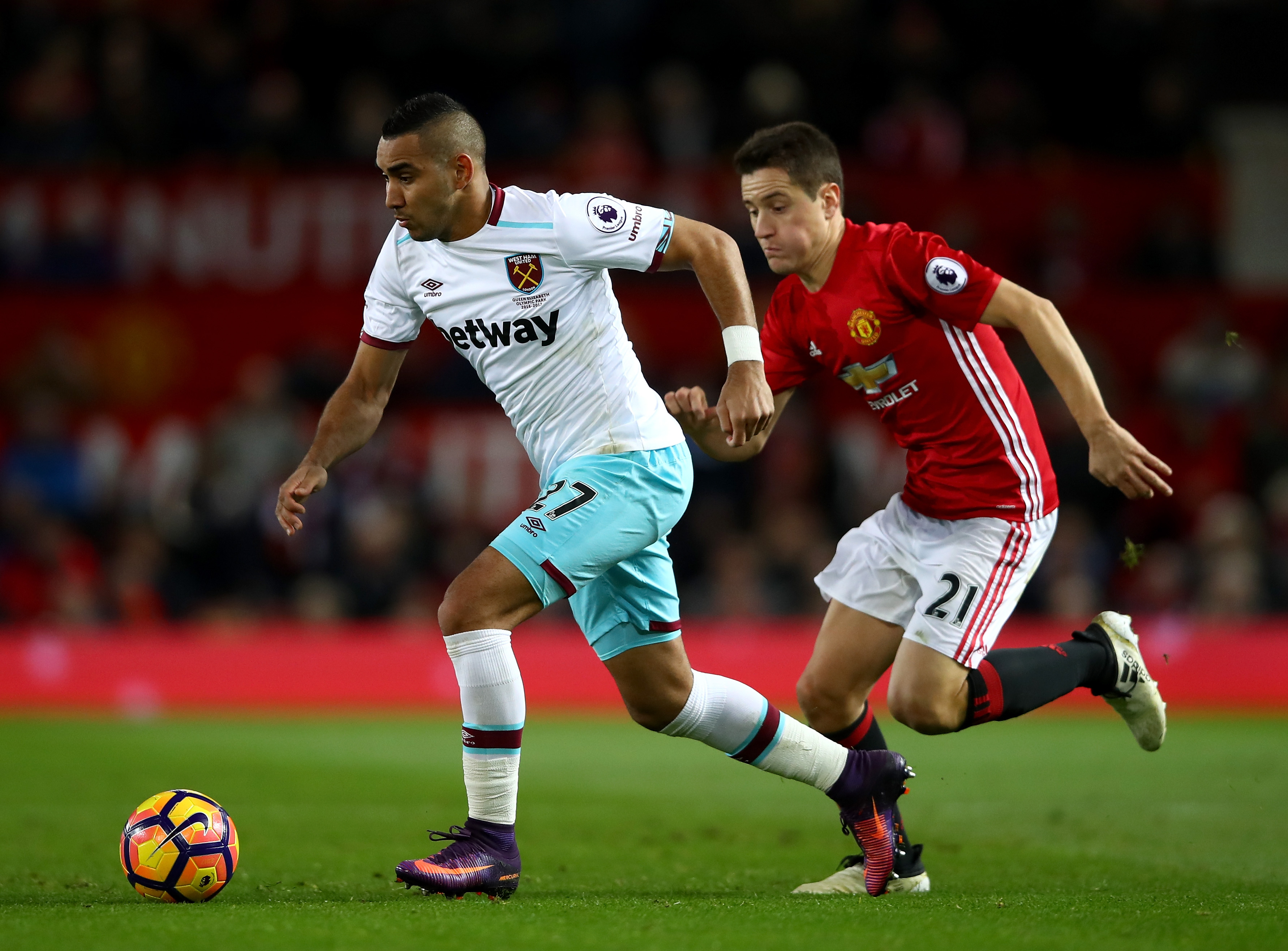 MANCHESTER, ENGLAND - NOVEMBER 27: Dimitri Payet of West Ham United (L) takes the ball past Ander Herrera of Manchester United (R) during the Premier League match between Manchester United and West Ham United at Old Trafford on November 27, 2016 in Manchester, England.  (Photo by Clive Brunskill/Getty Images)