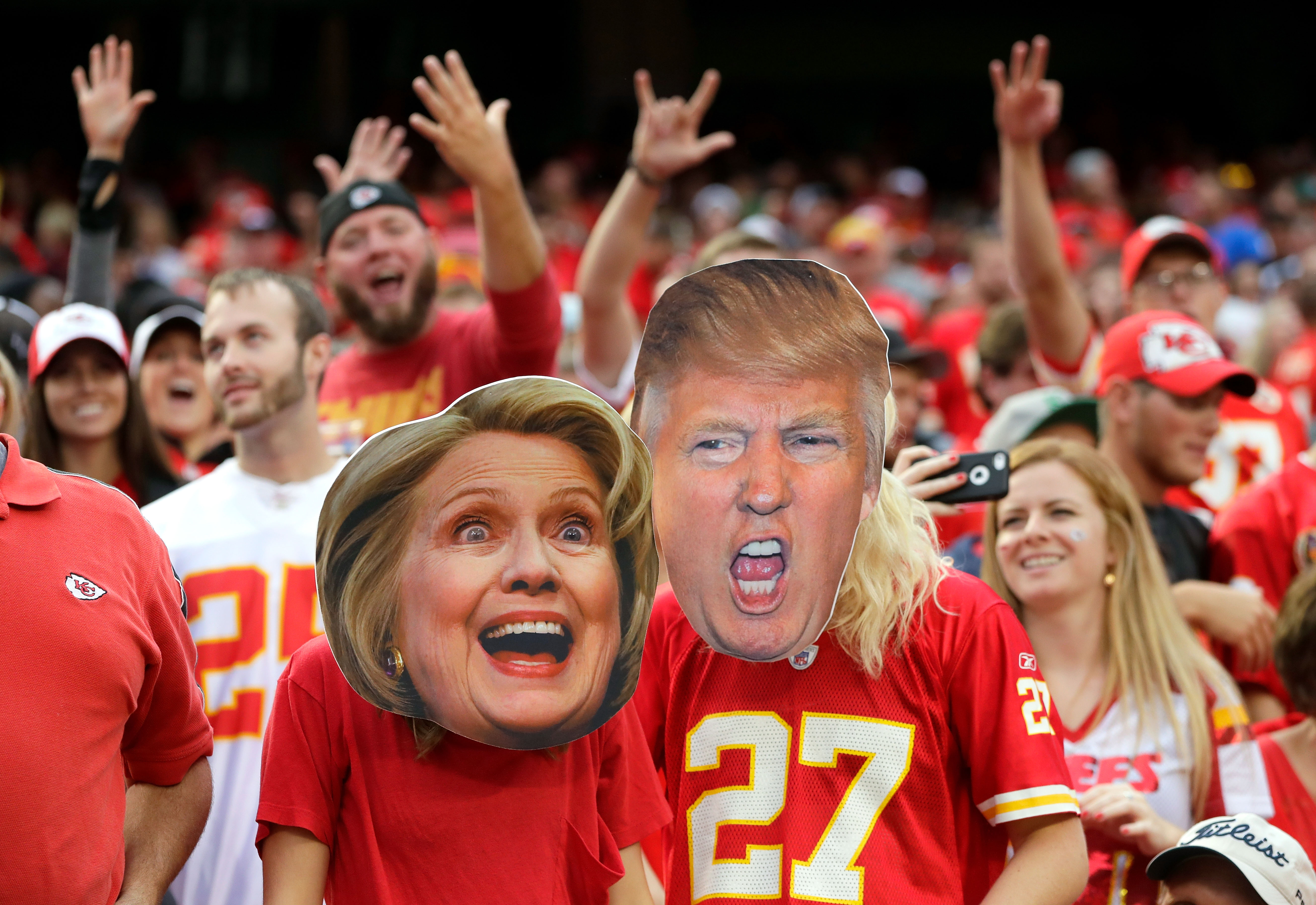 KANSAS CITY, MO - SEPTEMBER 25:  Kansas City Chiefs fans wear Hillary Clinton and Donald Trump masks during the game bethween the Chiefs and the New York Jets at Arrowhead Stadium on September 25, 2016 in Kansas City, Missouri.  (Photo by Jamie Squire/Getty Images)
