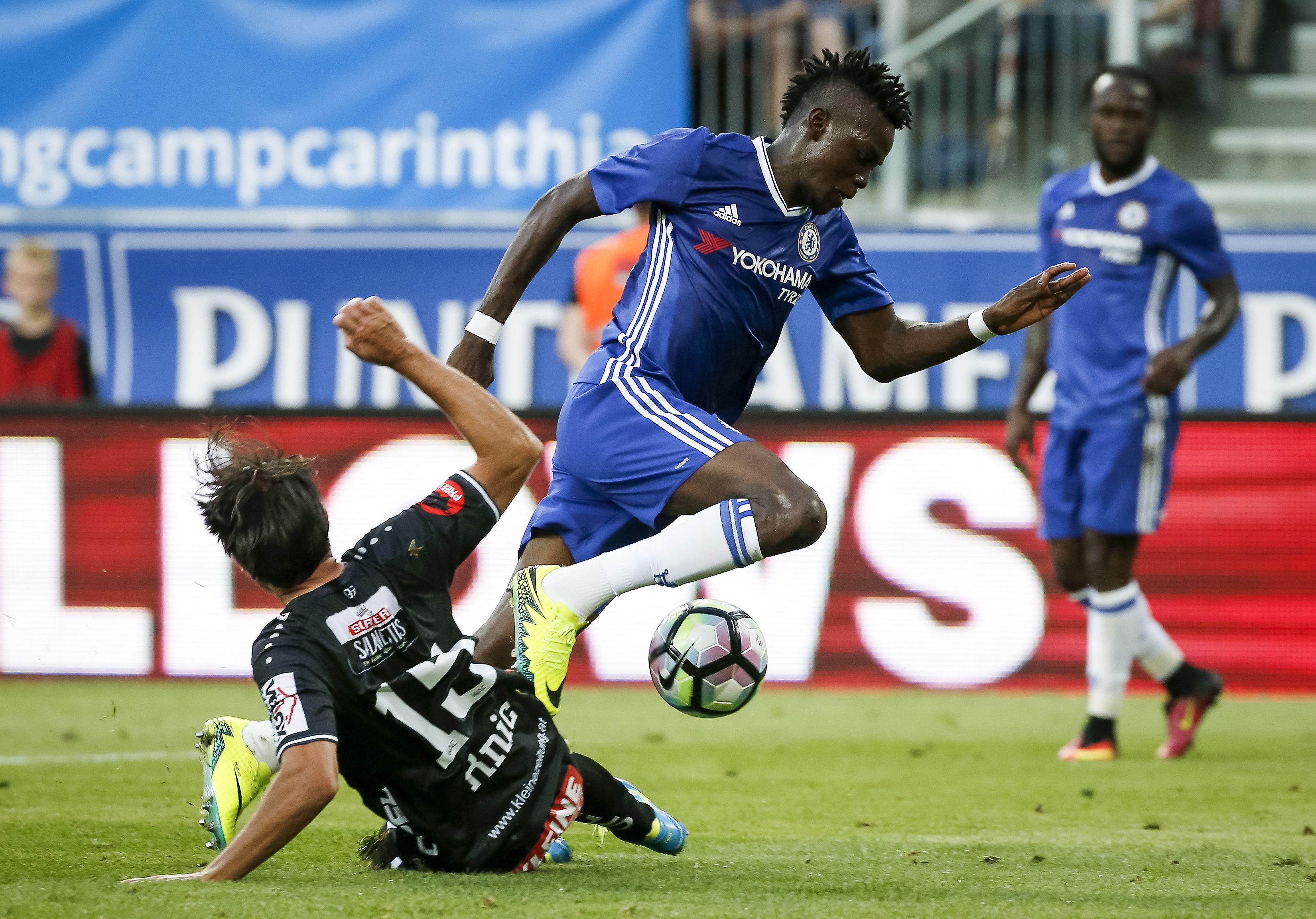 VELDEN, AUSTRIA - JULY 20:  Bertrand Traore (R) of Chelsea in action against Nemanja Rnic (L) of WAC RZ Pellets during the international friendly match between WAC RZ Pellets and Chelsea F.C. at Worthersee Stadion on July 20, 2016 in Velden, Austria. (Photo by Srdjan Stevanovic/Getty Images)