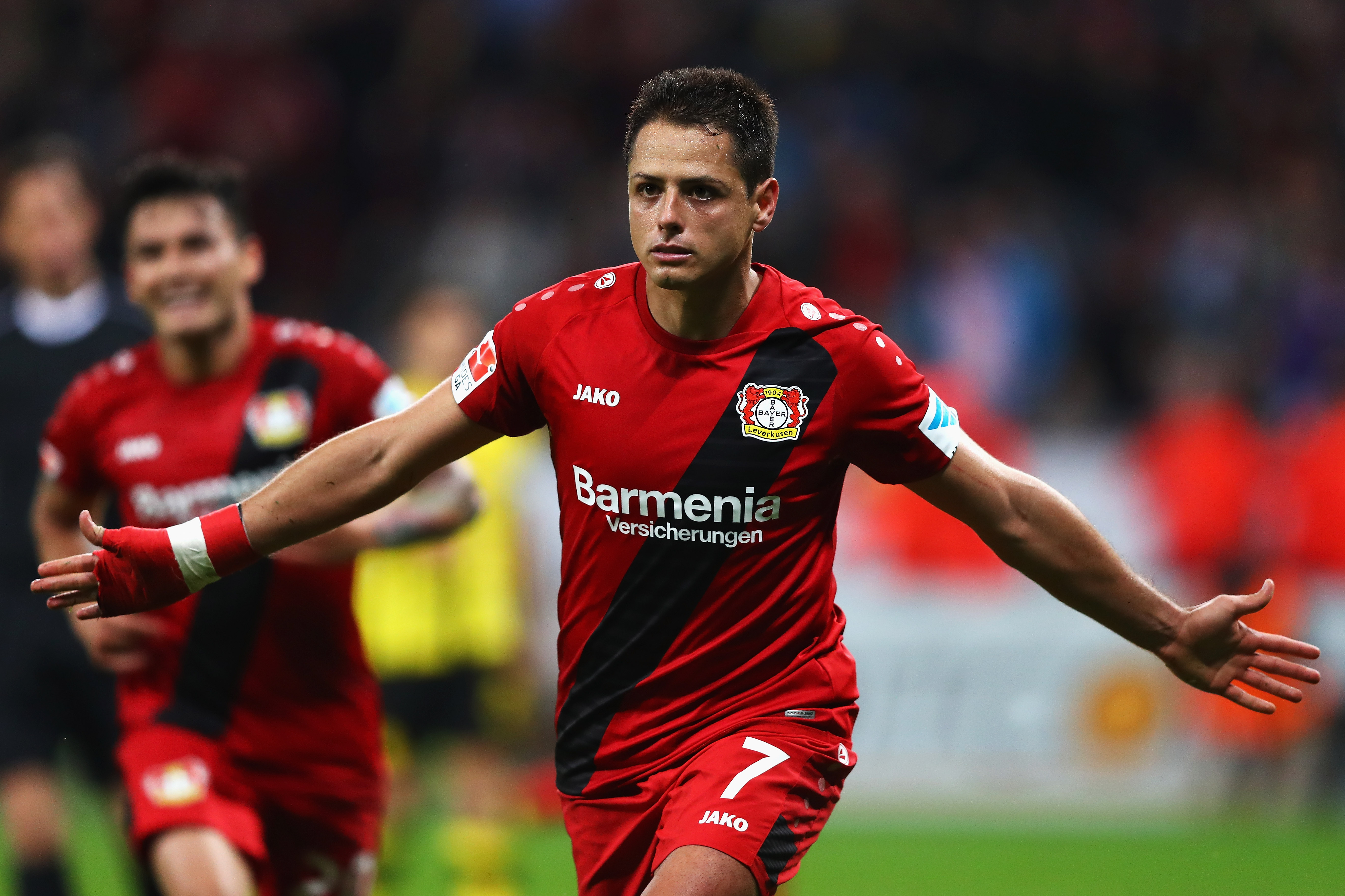 LEVERKUSEN, GERMANY - OCTOBER 01:  Javier Hernandez of Bayer 04 Leverkusen celebrates scoring his teams second goal of the game during the Bundesliga match between Bayer 04 Leverkusen and Borussia Dortmund at BayArena on October 1, 2016 in Leverkusen, Germany.  (Photo by Dean Mouhtaropoulos/Bongarts/Getty Images)