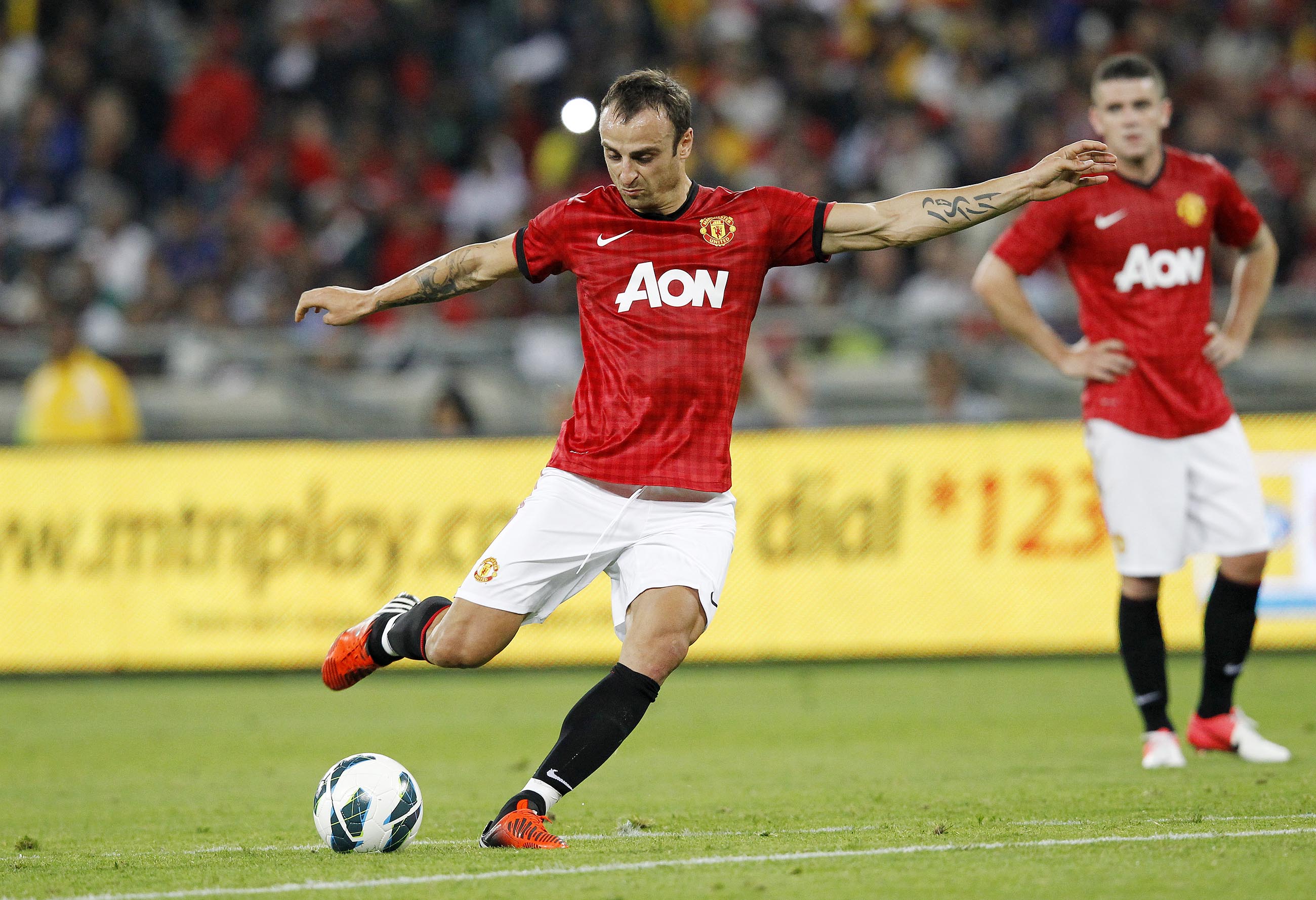 Bulgaria's Dimitar Berbatov, Manchester United's striker, shoots the ball during the MTN Football Invitational match against Amazulu at the Moses-Mabhida Stadium on July 18, 2012 in Durban. AFP PHOTO / ANESH DEBIKY        (Photo credit should read anesh debiky/AFP/GettyImages)