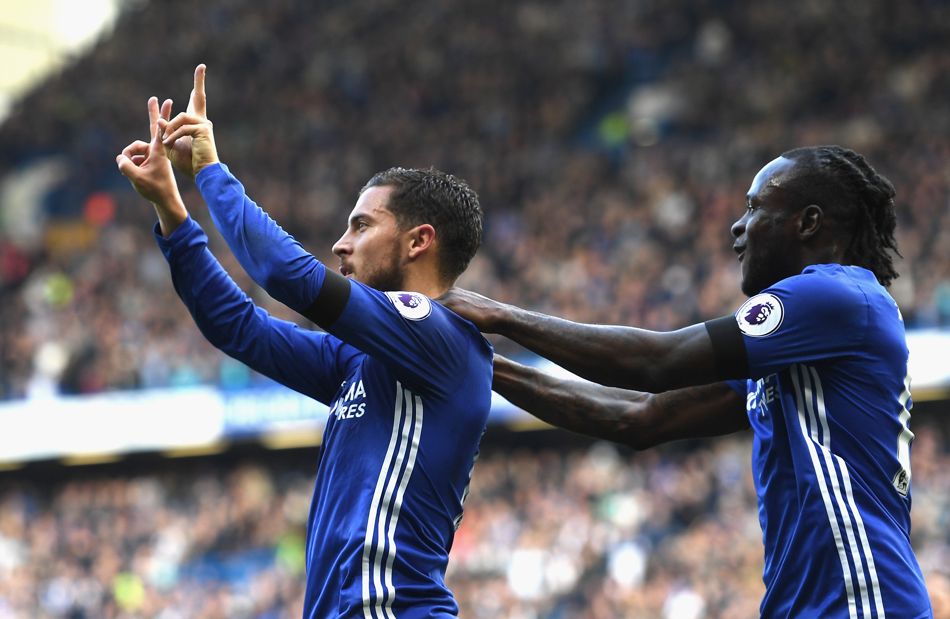 LONDON, ENGLAND - OCTOBER 15: Eden Hazard of Chelsea (L) celebrates scoring his sides second goal with his team mate Victor Moses of Chelsea (R)   during the Premier League match between Chelsea and Leicester City at Stamford Bridge on October 15, 2016 in London, England.  (Photo by Shaun Botterill/Getty Images)