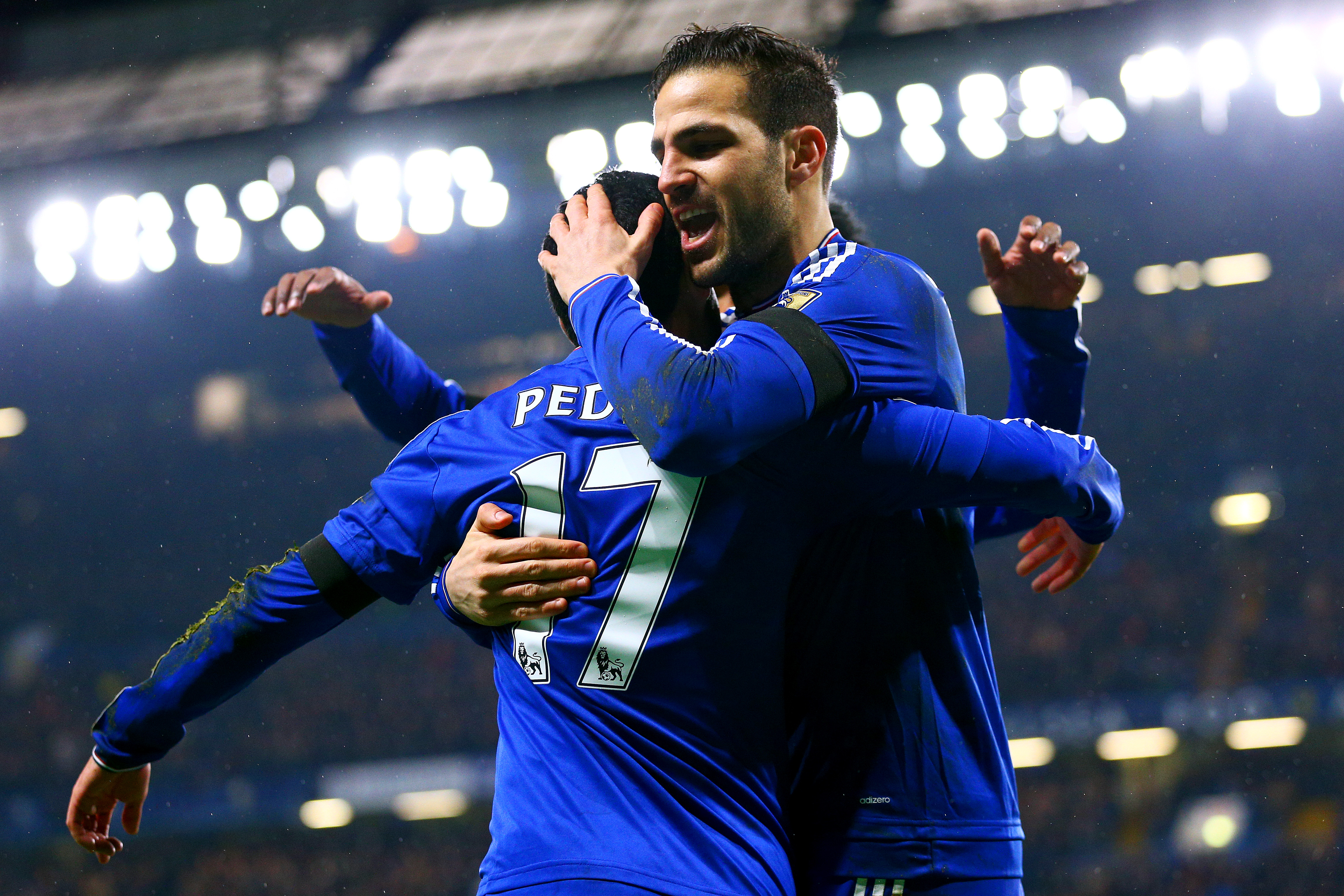 LONDON, ENGLAND - FEBRUARY 13:  Pedro (L) of Chelsea celebrates scoring his team's second goal with his team mate Cesc Fabregas (R) during the Barclays Premier League match between Chelsea and Newcastle United at Stamford Bridge on February 13, 2016 in London, England.  (Photo by Clive Mason/Getty Images)