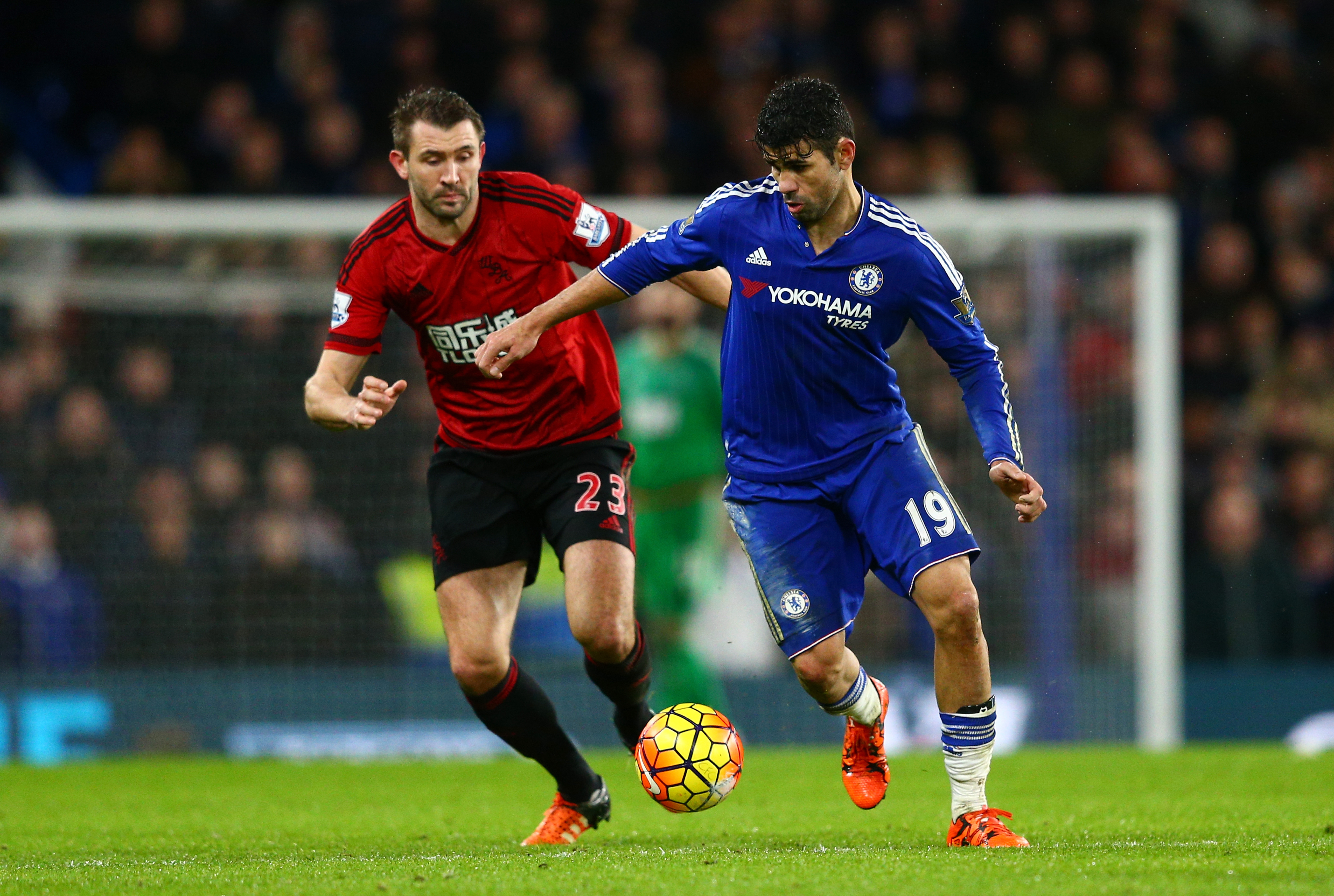 LONDON, ENGLAND - JANUARY 13: Diego Costa of Chelsea and Gareth McAuley of West Bromwich Albion compete for the ball during the Barclays Premier League match between Chelsea and West Bromwich Albion at Stamford Bridge on January 13, 2016 in London, England.  (Photo by Clive Mason/Getty Images)