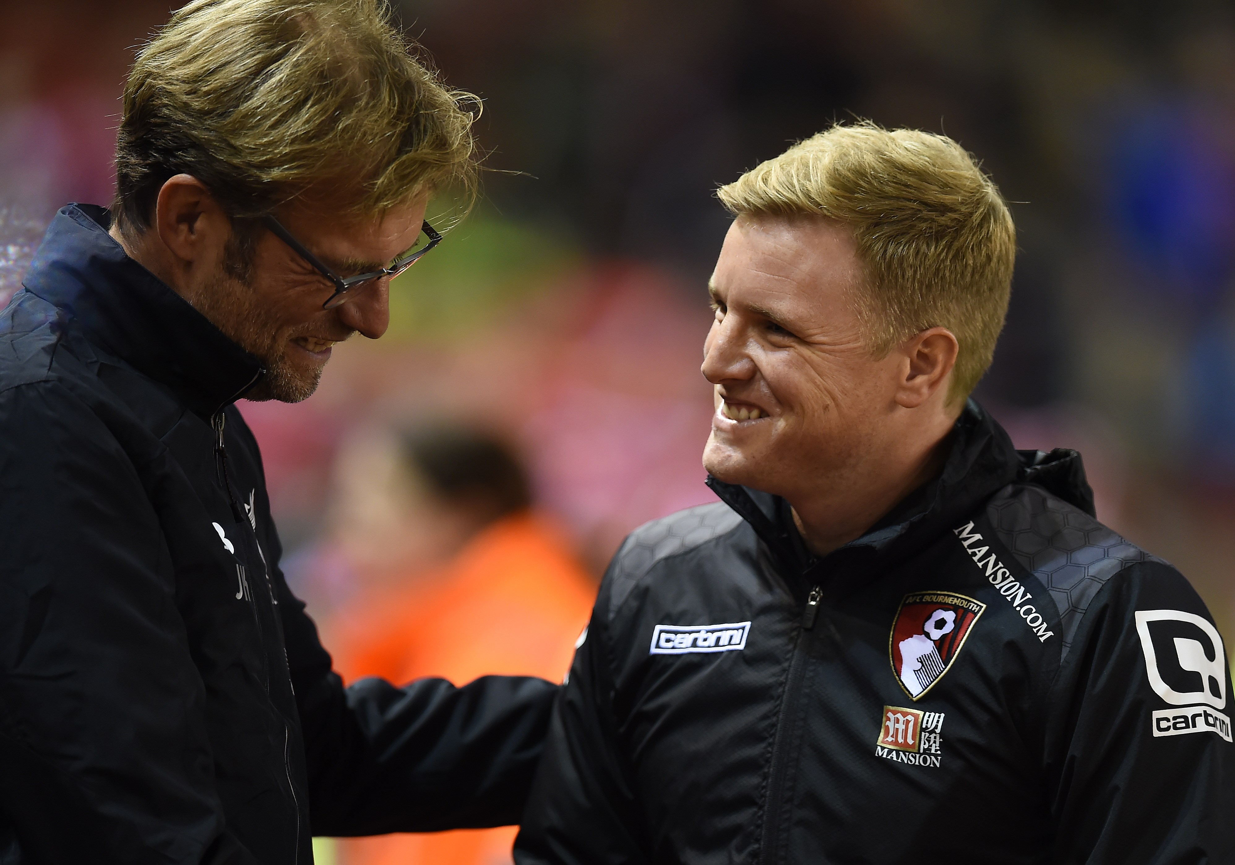 Liverpool's German manager Jurgen Klopp (L) shakes hands with Bournemouth's English manager Eddie Howe ahead of the English League Cup fourth round football match between Liverpool and Bournemouth at Anfield stadium in Liverpool, north west England on October 28, 2015. AFP PHOTO / PAUL ELLIS

RESTRICTED TO EDITORIAL USE. NO USE WITH UNAUTHORIZED AUDIO, VIDEO, DATA, FIXTURE LISTS, CLUB/LEAGUE LOGOS OR 'LIVE' SERVICES. ONLINE IN-MATCH USE LIMITED TO 75 IMAGES, NO VIDEO EMULATION. NO USE IN BETTING, GAMES OR SINGLE CLUB/LEAGUE/PLAYER PUBLICATIONS.        (Photo credit should read PAUL ELLIS/AFP/Getty Images)