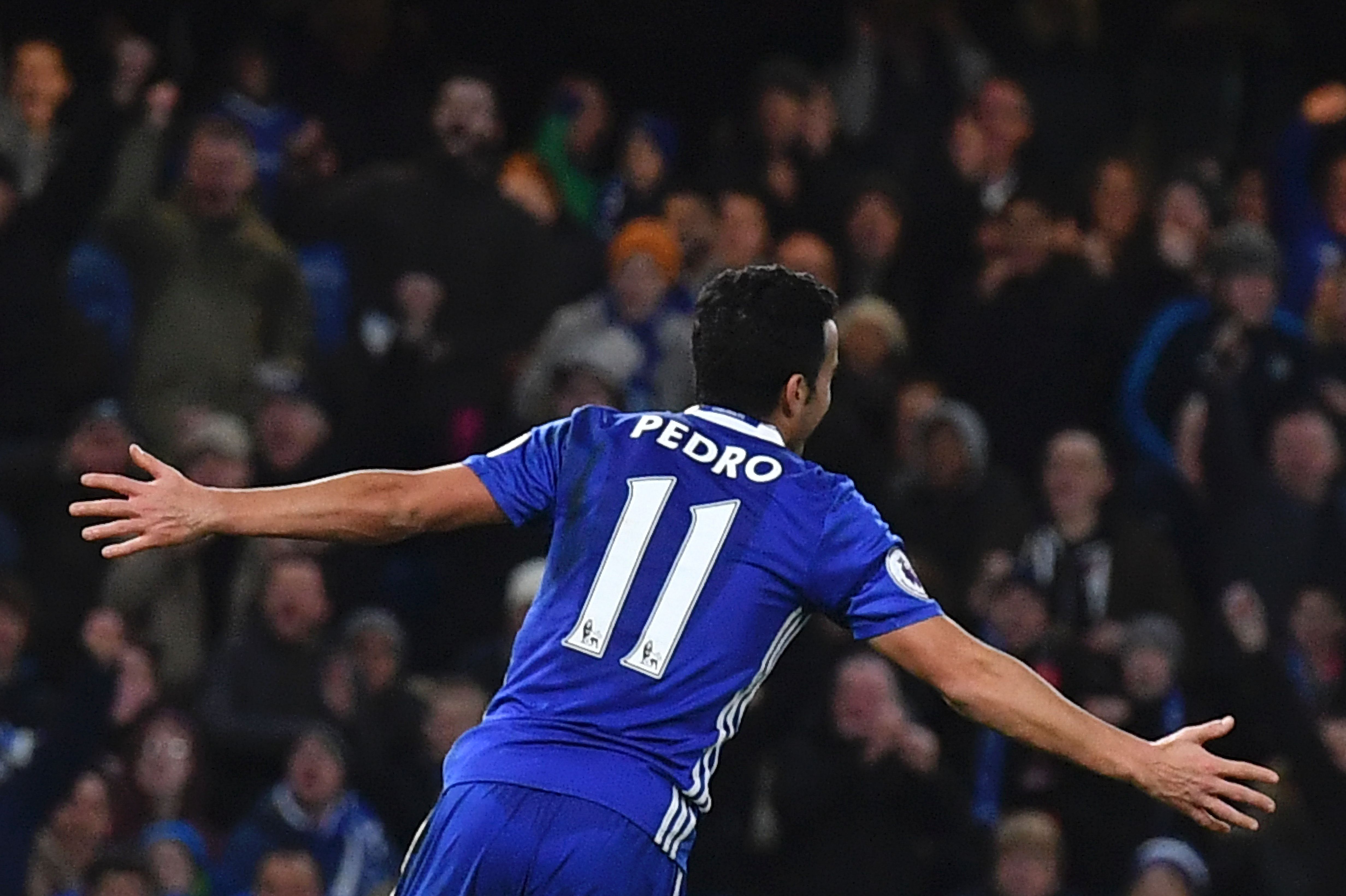 Chelsea's Spanish midfielder Pedro celebrates scoring their third goal during the English Premier League football match between Chelsea and Bournemouth at Stamford Bridge in London on December 26, 2016. (Photo by Ben Stansall/AFP/Getty Images)