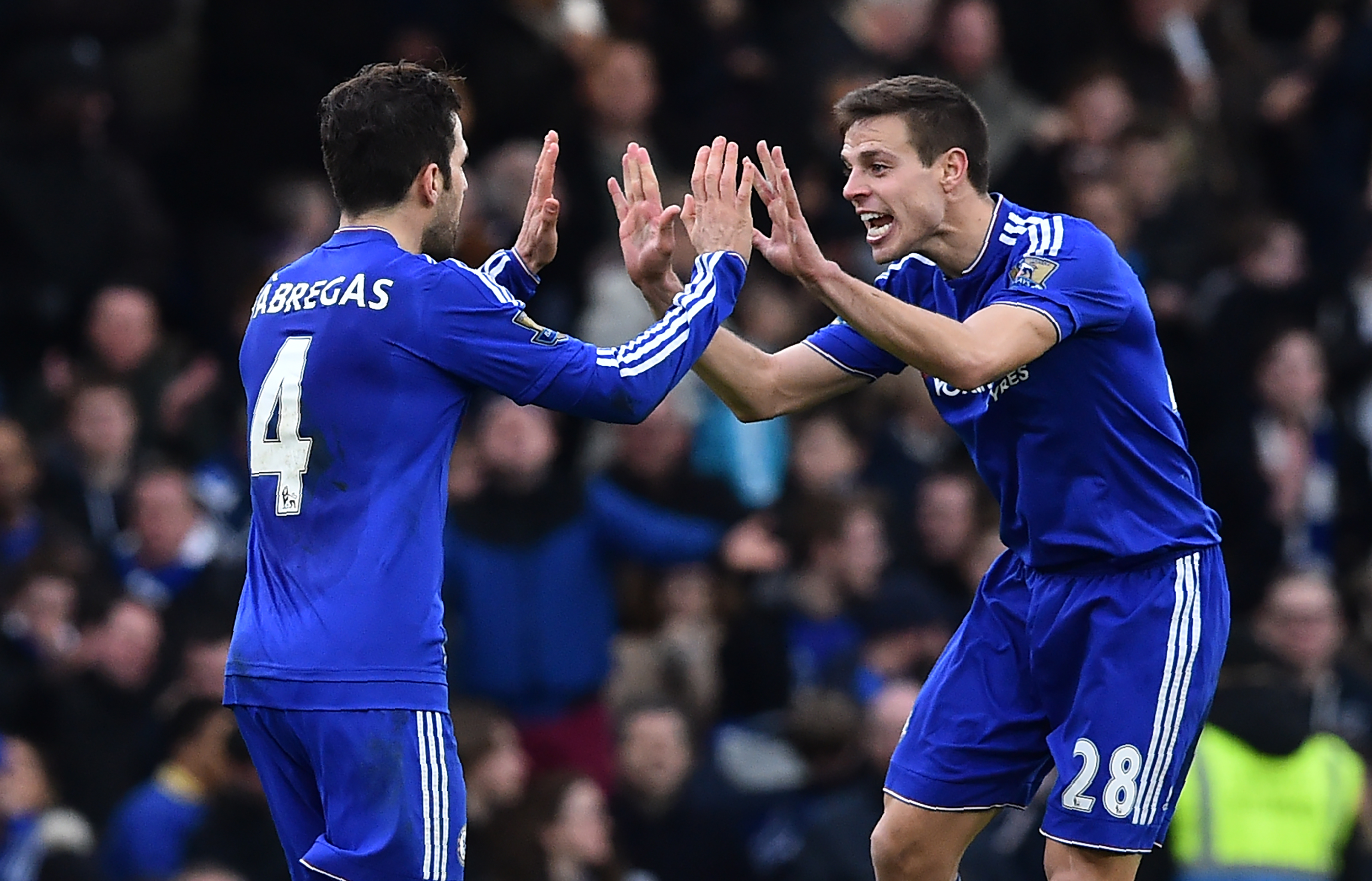 Chelsea's Spanish midfielder Cesc Fabregas (L) celebrates with Chelsea's Spanish defender Cesar Azpilicueta after scoring his penalty during the English Premier League football match between Chelsea and West Ham United at Stamford Bridge in London on March 19, 2016.
The game finished 2-2. / AFP / Ben STANSALL / RESTRICTED TO EDITORIAL USE. No use with unauthorized audio, video, data, fixture lists, club/league logos or 'live' services. Online in-match use limited to 75 images, no video emulation. No use in betting, games or single club/league/player publications.  /         (Photo credit should read BEN STANSALL/AFP/Getty Images)