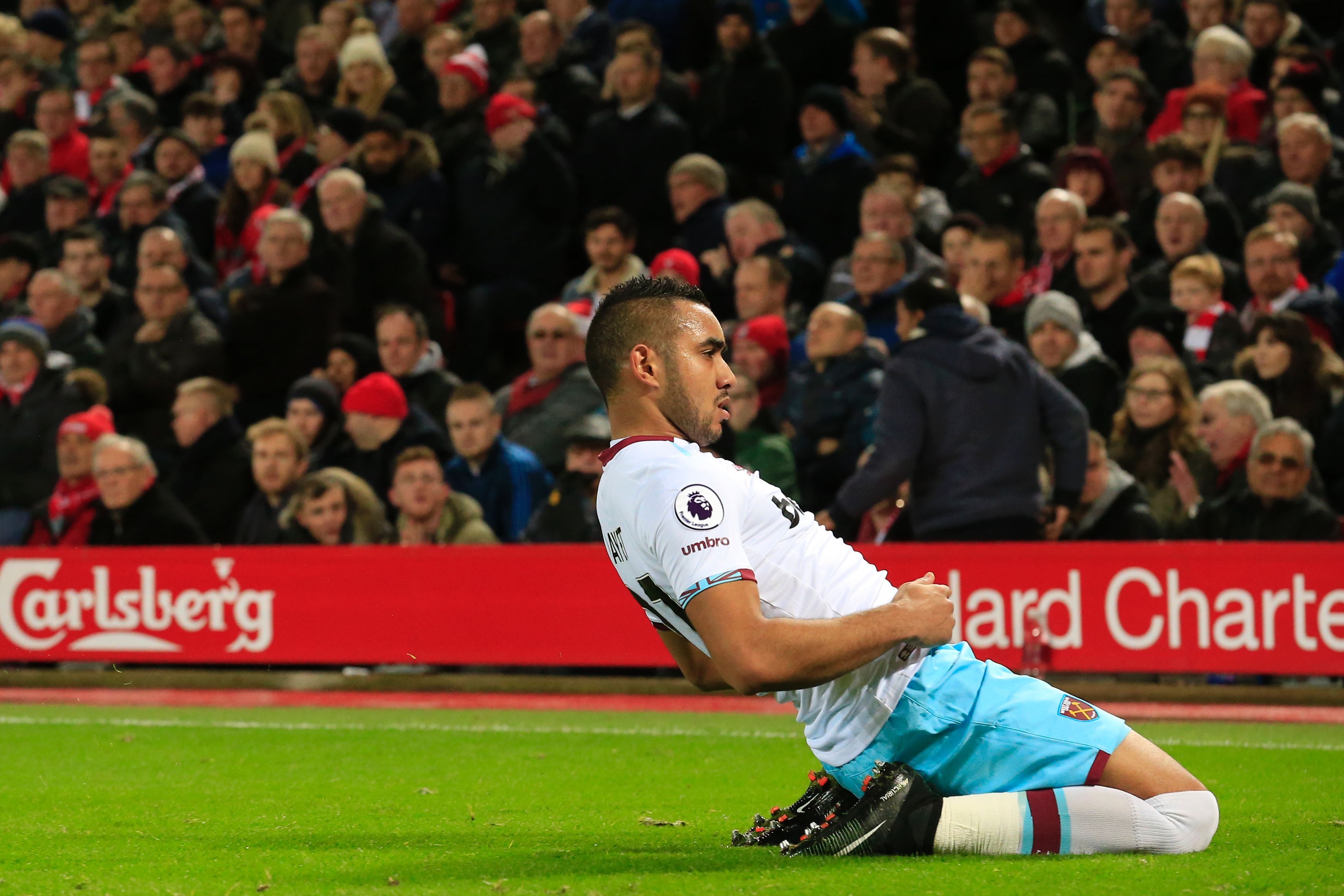 West Ham United's French midfielder Dimitri Payet celebrates after scoring their first goal during the English Premier League football match between Liverpool and West Ham United at Anfield in Liverpool, north west England on December 11, 2016. / AFP / Lindsey PARNABY / RESTRICTED TO EDITORIAL USE. No use with unauthorized audio, video, data, fixture lists, club/league logos or 'live' services. Online in-match use limited to 75 images, no video emulation. No use in betting, games or single club/league/player publications.  /         (Photo credit should read LINDSEY PARNABY/AFP/Getty Images)
