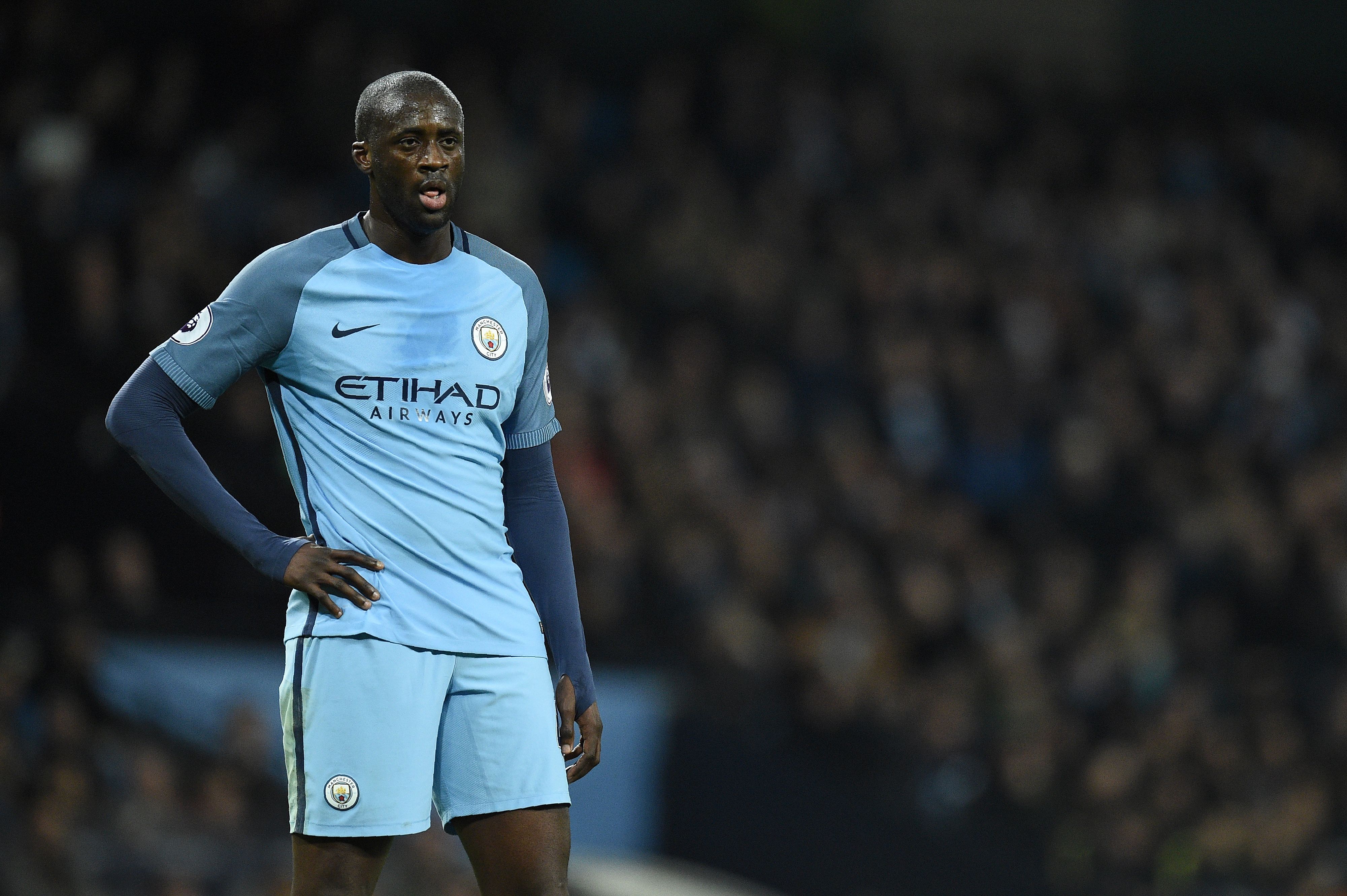 Manchester City's Ivorian midfielder Yaya Toure reacts during the English Premier League football match between Manchester City and Arsenal at the Etihad Stadium in Manchester, north west England, on December 18, 2016. / AFP / Oli SCARFF / RESTRICTED TO EDITORIAL USE. No use with unauthorized audio, video, data, fixture lists, club/league logos or 'live' services. Online in-match use limited to 75 images, no video emulation. No use in betting, games or single club/league/player publications.  /         (Photo credit should read OLI SCARFF/AFP/Getty Images)