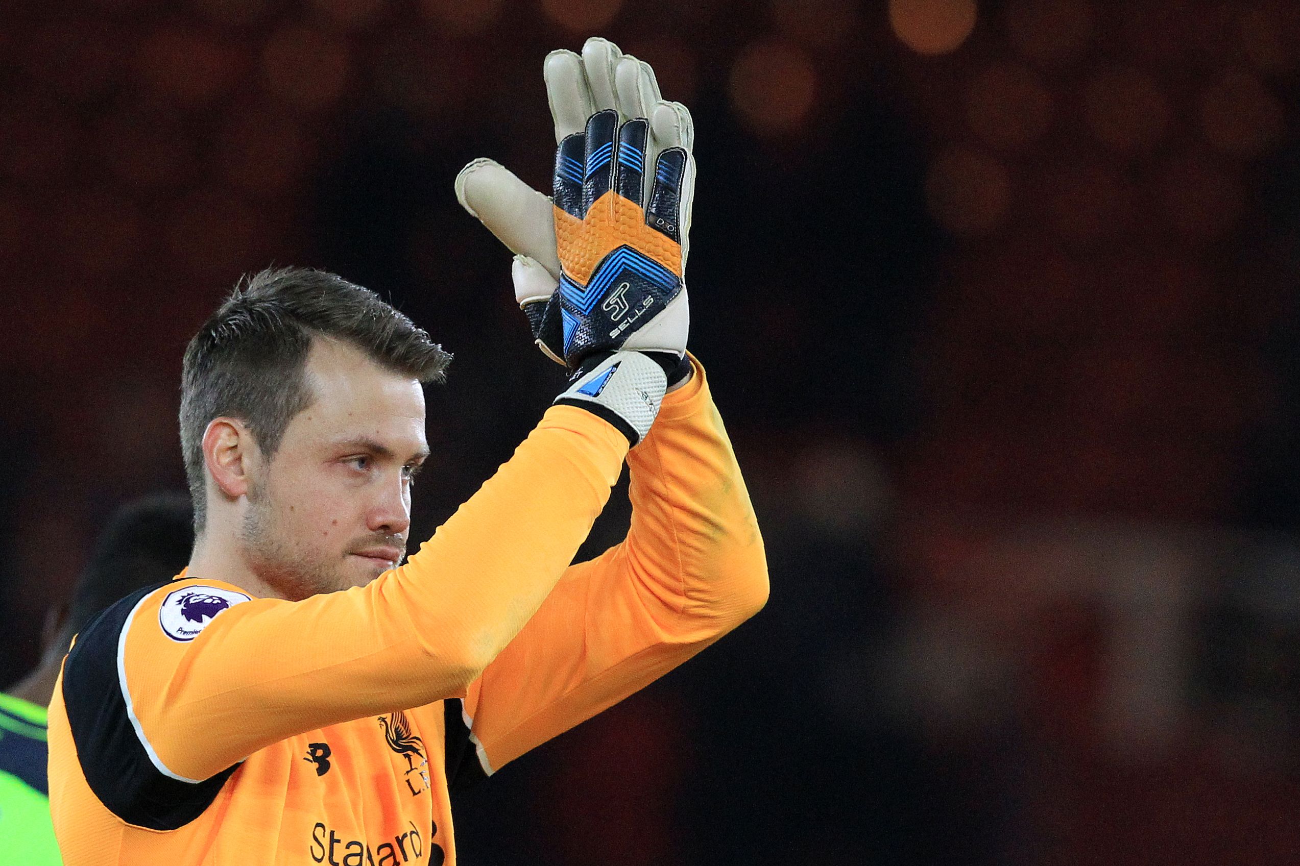 Liverpool's Belgian goalkeeper Simon Mignolet applauds the fans following the English Premier League football match between Middlesbrough and Liverpool at Riverside Stadium in Middlesbrough, northeast England on December 14, 2016.
Liverpool won the match 3-0. (Photo by Lindsey Parnaby/AFP/Getty Images)