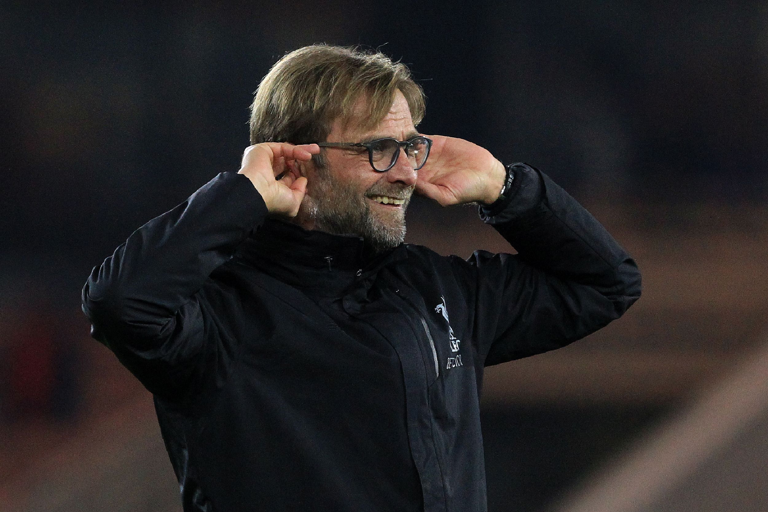 Liverpool's German manager Jurgen Klopp gestures to the fans following the English Premier League football match between Middlesbrough and Liverpool at Riverside Stadium in Middlesbrough, northeast England on December 14, 2016.
Liverpool won the match 3-0. / AFP / Lindsey PARNABY / RESTRICTED TO EDITORIAL USE. No use with unauthorized audio, video, data, fixture lists, club/league logos or 'live' services. Online in-match use limited to 75 images, no video emulation. No use in betting, games or single club/league/player publications.  /         (Photo credit should read LINDSEY PARNABY/AFP/Getty Images)