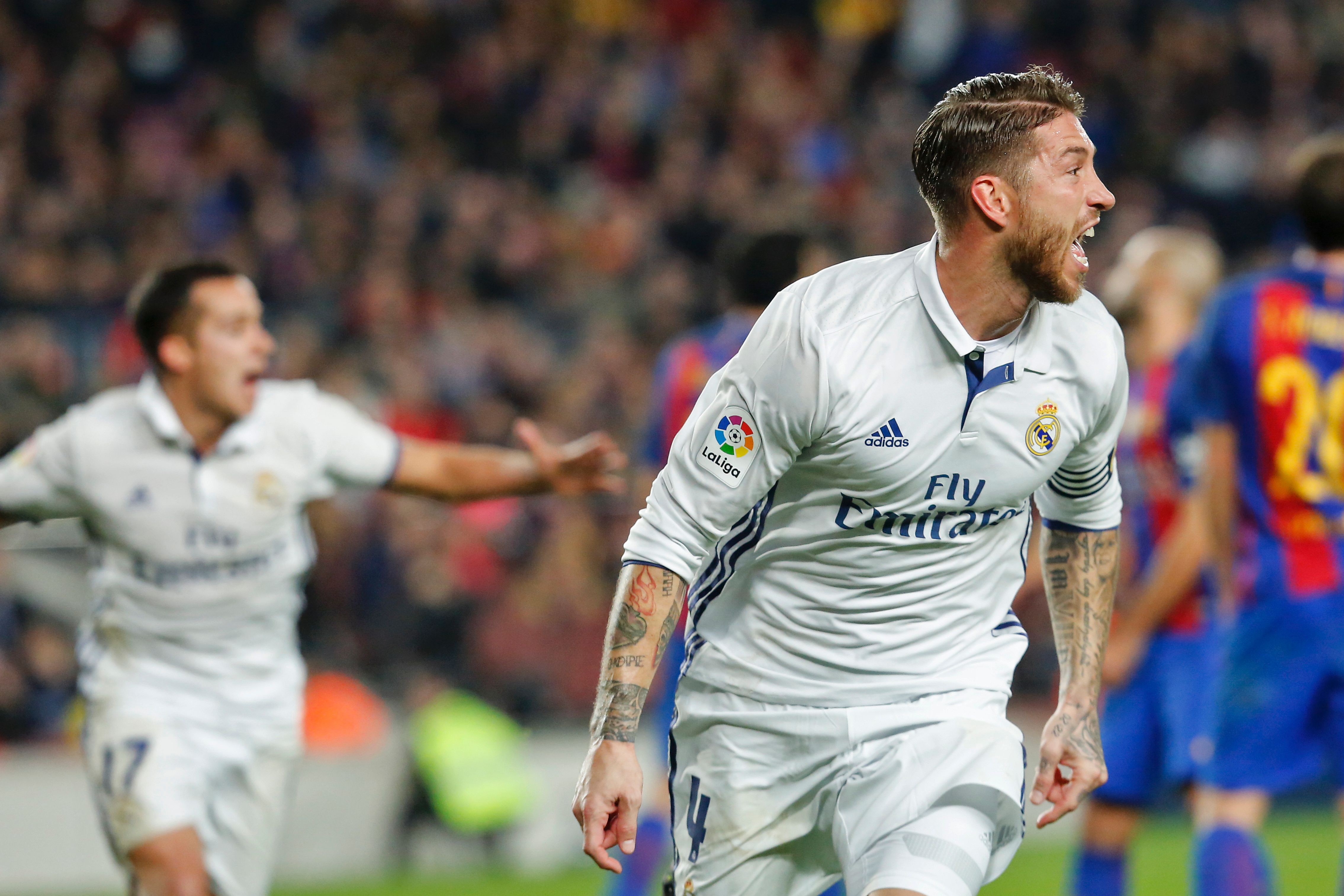 Real Madrid's defender Sergio Ramos celebrates after scoring the equalizer during the Spanish league football match FC Barcelona vs Real Madrid CF at the Camp Nou stadium in Barcelona on December 3, 2016. / AFP / PAU BARRENA        (Photo credit should read PAU BARRENA/AFP/Getty Images)