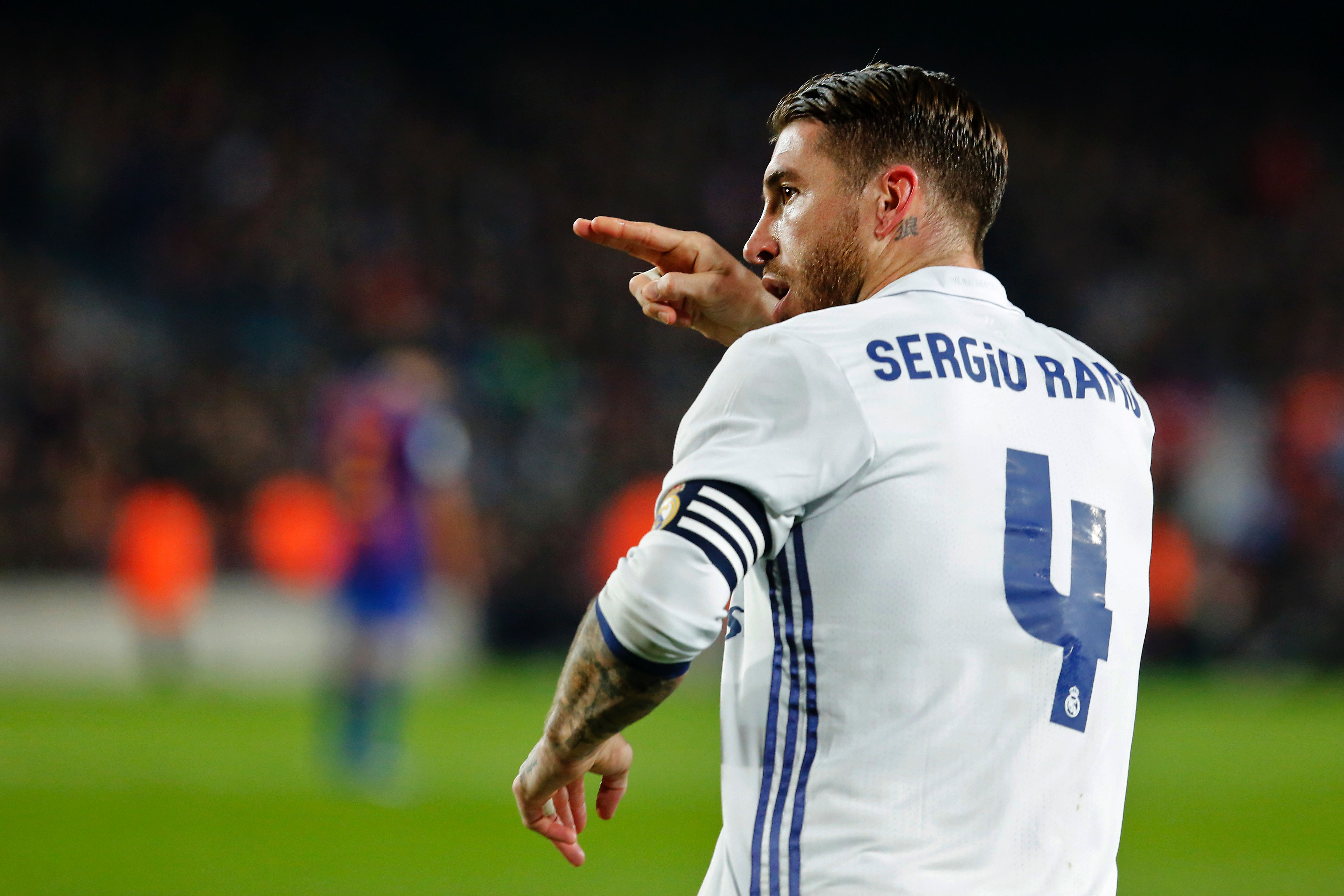 Real Madrid's defender Sergio Ramos celebrates after scoring the equalizer during the Spanish league football match FC Barcelona vs Real Madrid CF at the Camp Nou stadium in Barcelona on December 3, 2016. / AFP / PAU BARRENA        (Photo credit should read PAU BARRENA/AFP/Getty Images)