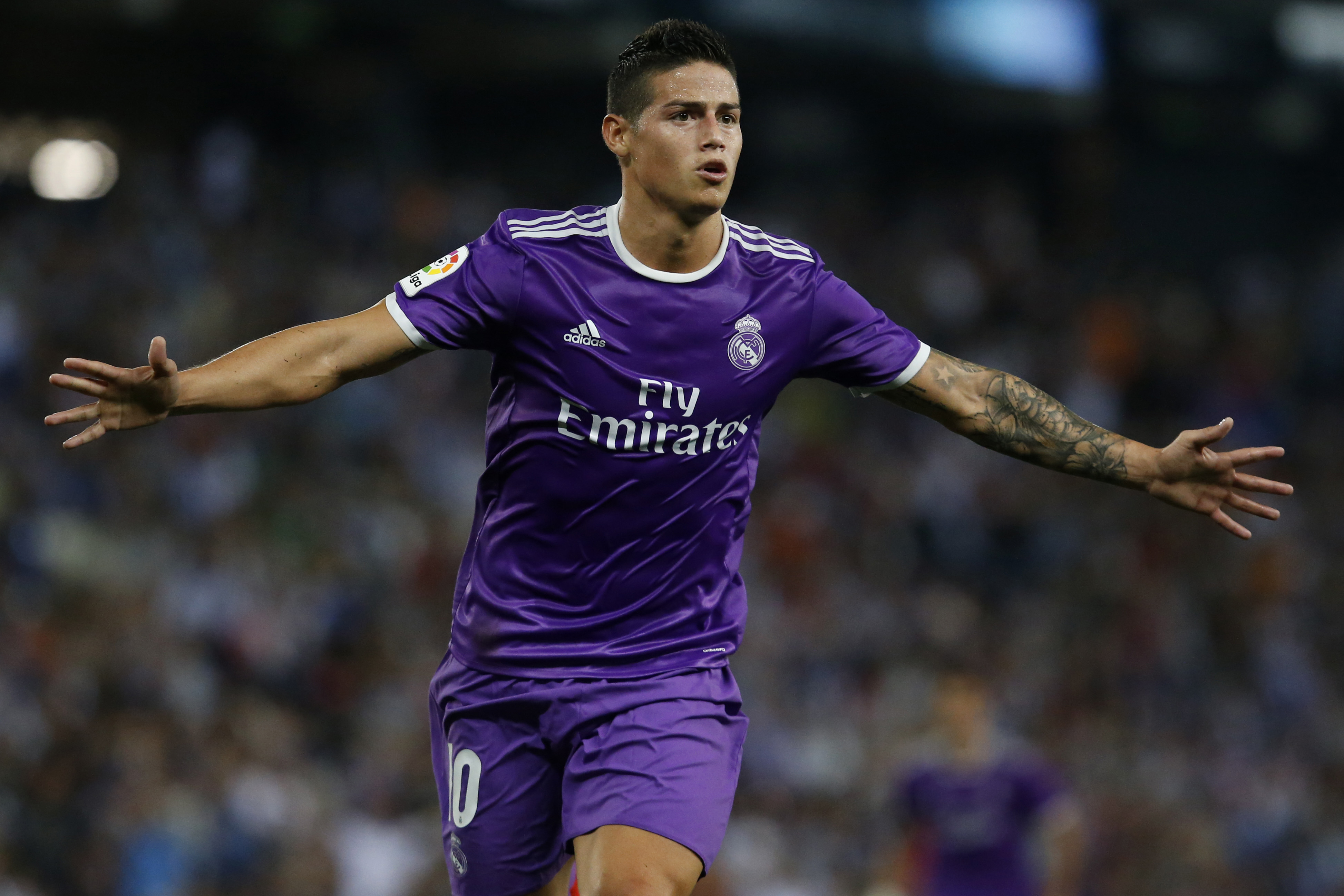 Real Madrid's Colombian midfielder James Rodriguez celebrates after scoring during the Spanish league football match RCD Espanyol vs Real Madrid CF at the Cornella-El Prat stadium in Cornella de Llobregat on September 18, 2016. / AFP / PAU BARRENA        (Photo credit should read PAU BARRENA/AFP/Getty Images)