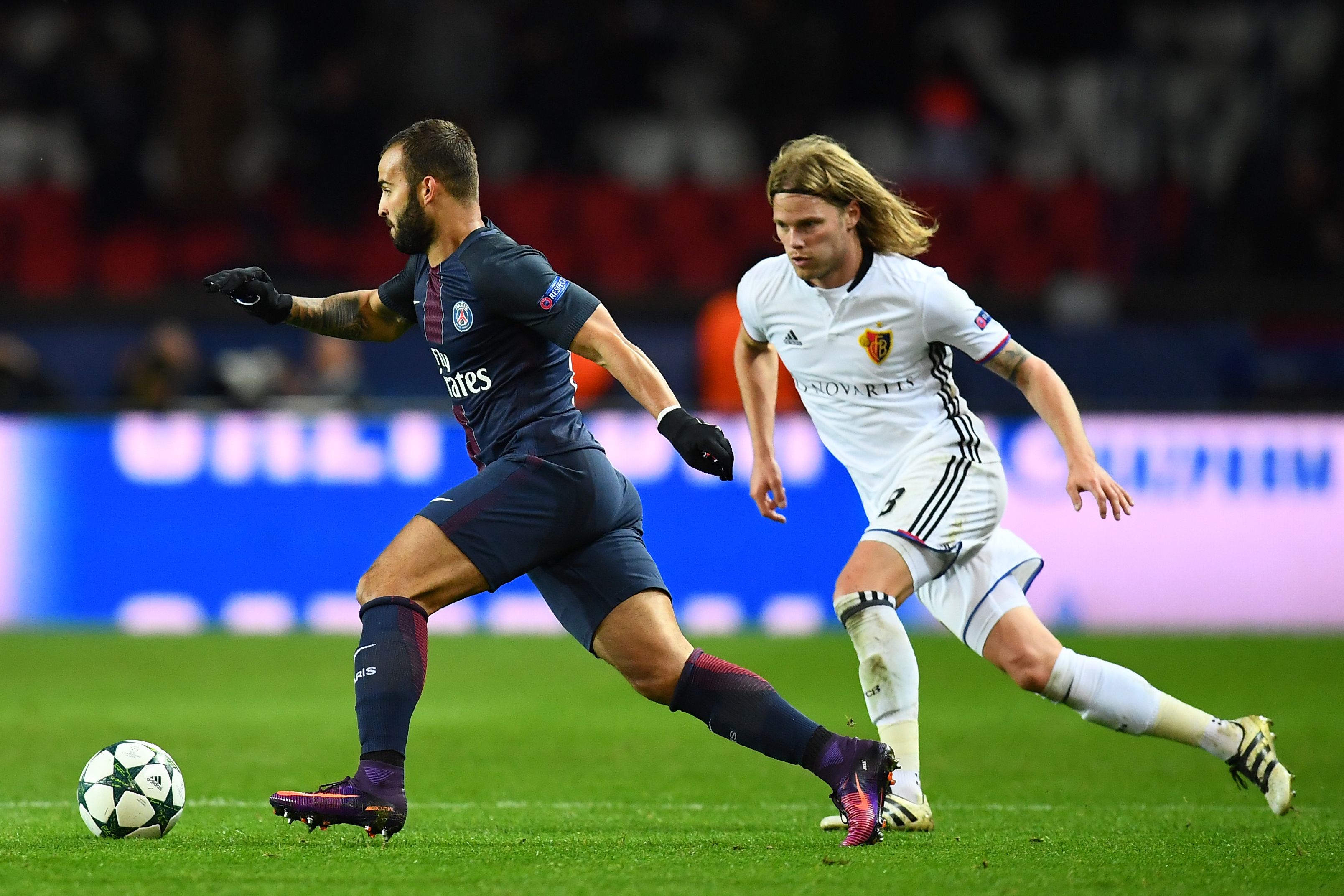 Basel's Icelandic midfielder Birkir Bjarnason (R) challenges Paris Saint-Germain's Spanish forward Jese Rodriguez during the UEFA Champions League group A football match between Paris Saint-Germain (PSG) and Basel at the Parc des Princes stadium in Paris on October 19, 2016. / AFP / FRANCK FIFE        (Photo credit should read FRANCK FIFE/AFP/Getty Images)