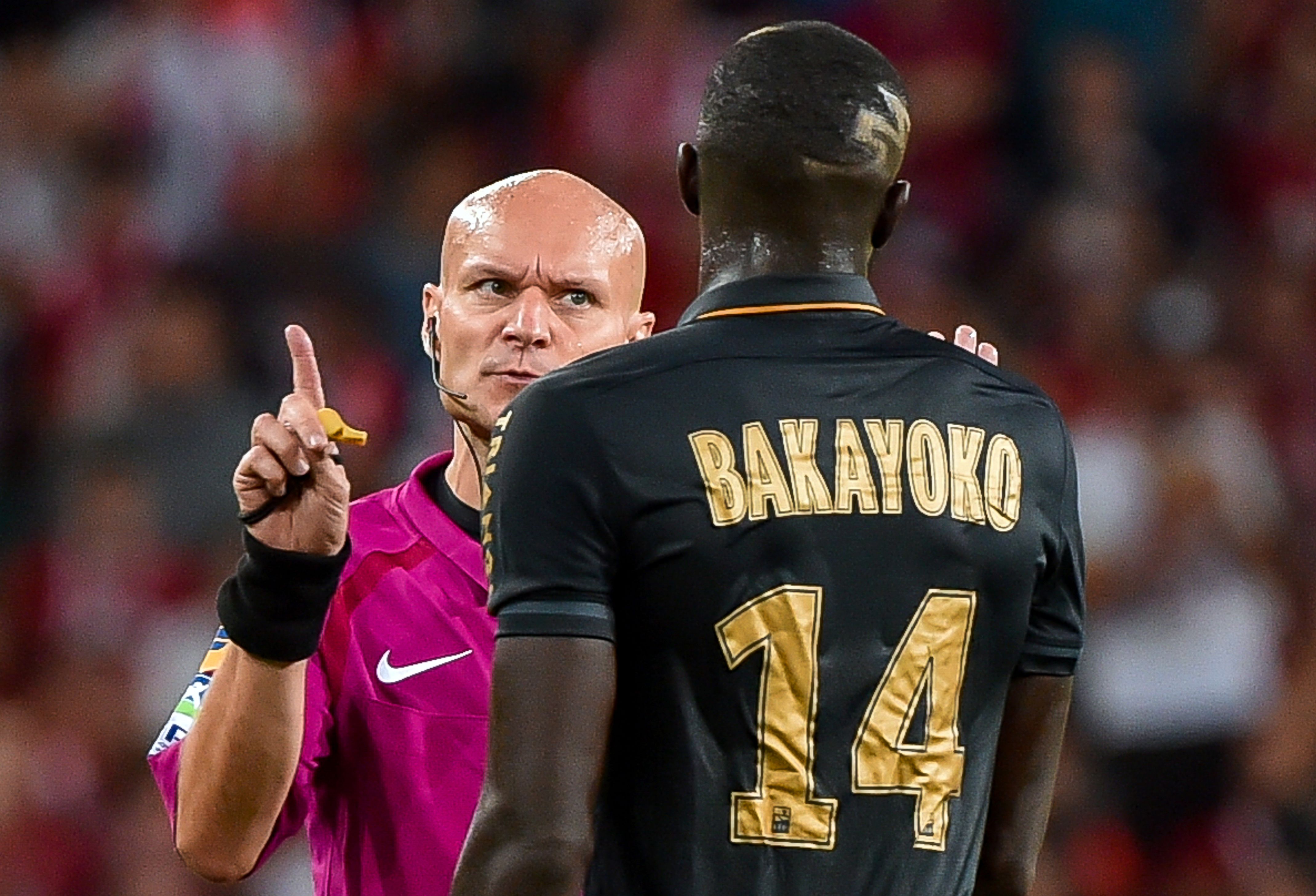 Chief arbiter Tony Chapron (L) argues with Monaco's French midfielder Tiemoue Bakayoko (R) during the French L1 football match between Lille OSC (LOSC) and AS Monaco FC (ASMFC) at the Pierre-Mauroy Stadium in Villeneuve d'Ascq, near Lille, northern France, on September 10, 2016. / AFP / PHILIPPE HUGUEN        (Photo credit should read PHILIPPE HUGUEN/AFP/Getty Images)