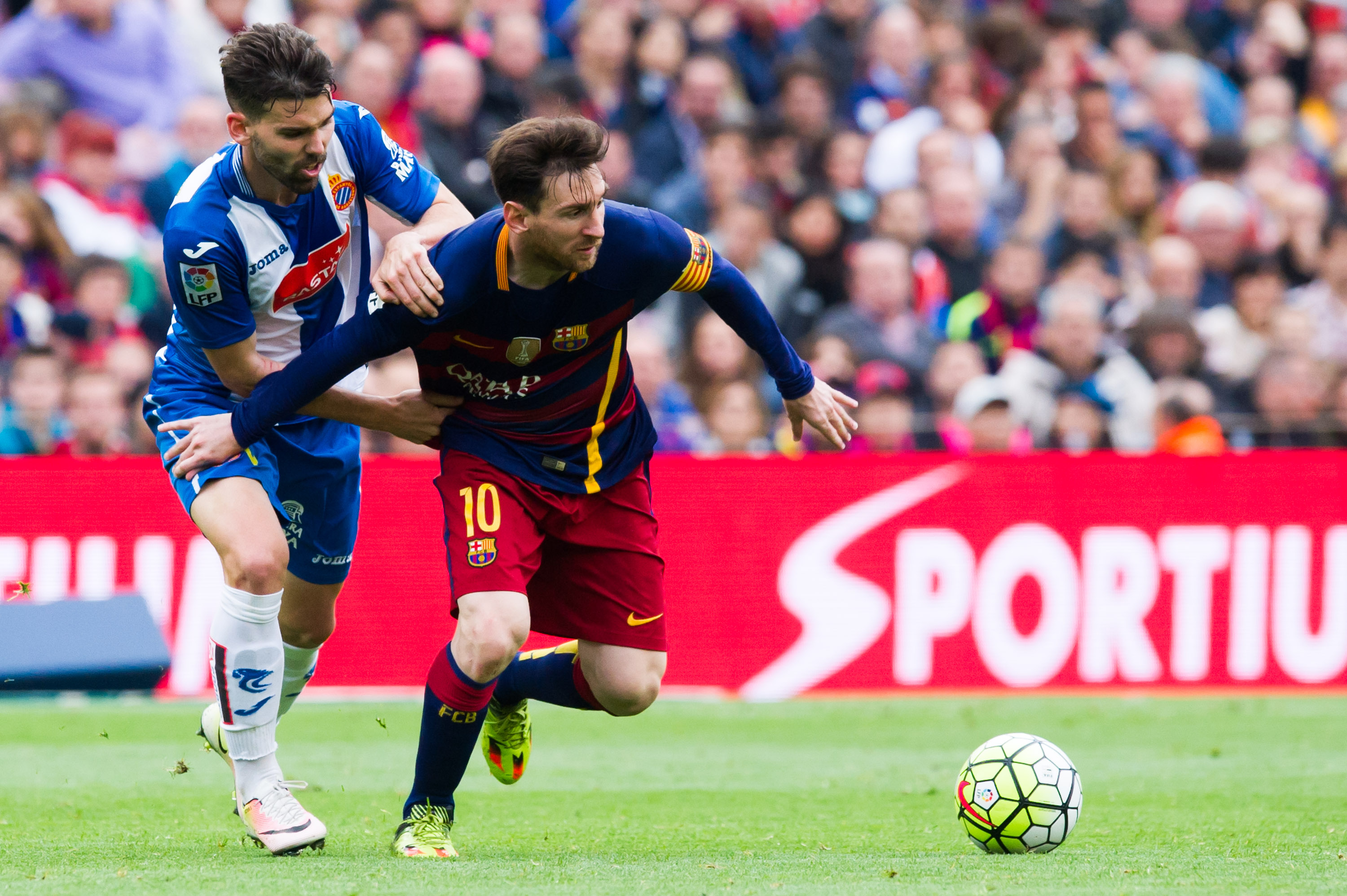 BARCELONA, SPAIN - MAY 08:  Lionel Messi of FC Barcelona protects the ball from Victor Alvarez of RCD Espanyol during the La Liga match between FC Barcelona and RCD Espanyol at Camp Nou on May 8, 2016 in Barcelona, Spain.  (Photo by Alex Caparros/Getty Images)