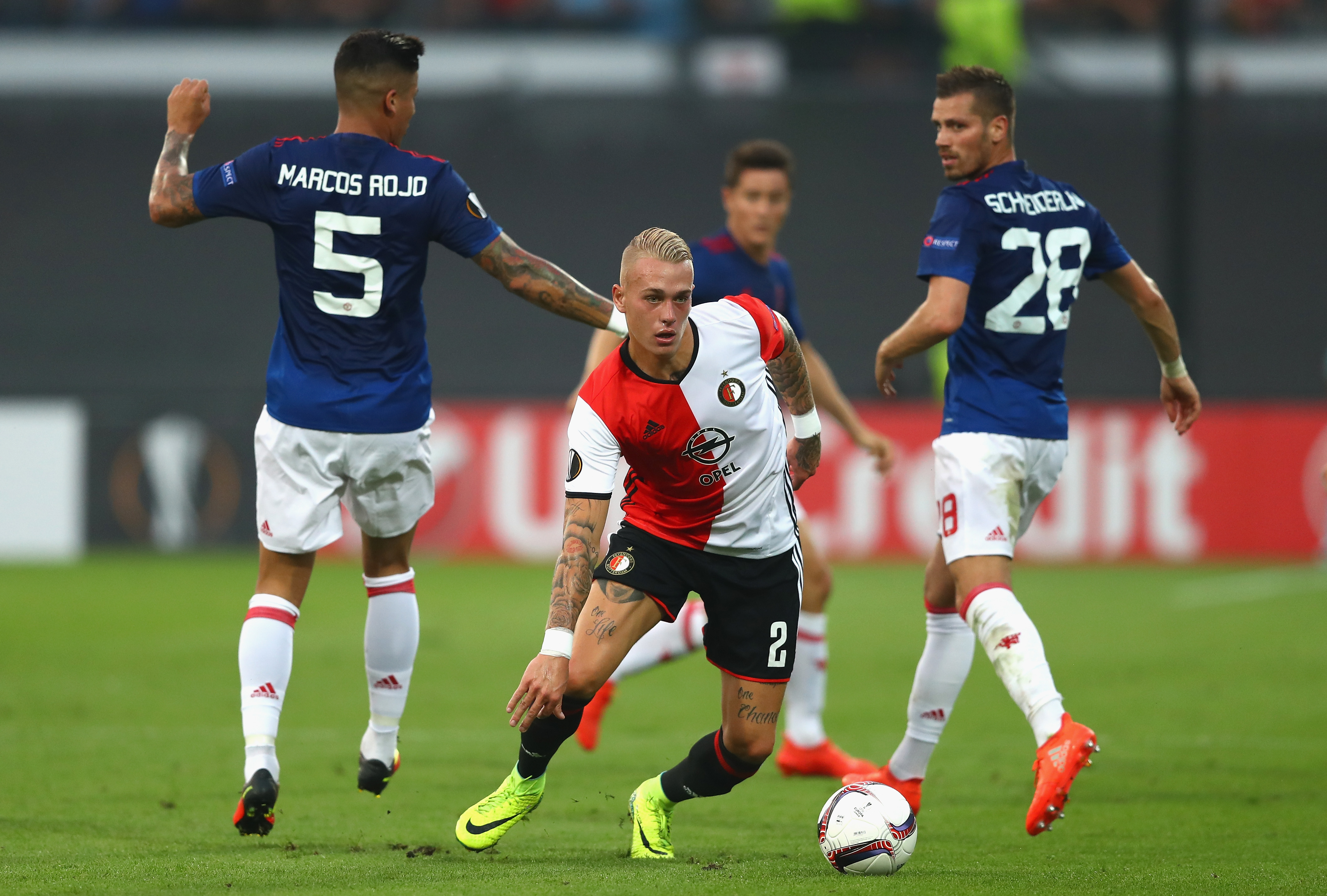 ROTTERDAM, NETHERLANDS - SEPTEMBER 15:  Rick Karsdorp of Feyenoord takes the ball past Marcos Rojo and Morgan Schneiderlin of Manchester United  during the UEFA Europa League Group A match between Feyenoord and Manchester United FC at Feijenoord Stadion on September 15, 2016 in Rotterdam, .  (Photo by Dean Mouhtaropoulos/Getty Images)