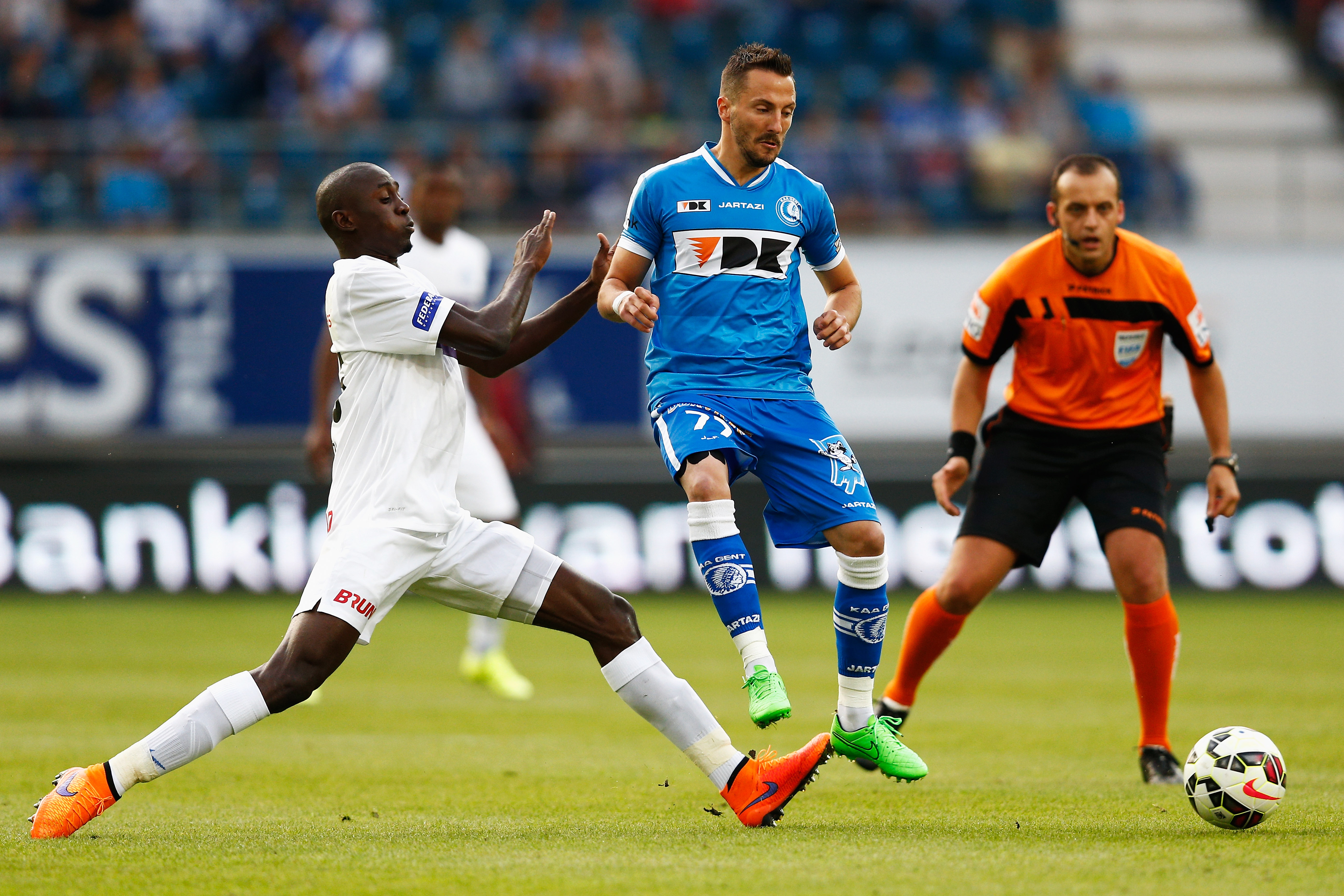 GENT, BELGIUM - JULY 31:  Danijel Milicevic of Gent battles for the ball with Wilfred Ndidi of Genk  during the Jupiler League match between KAA Gent and KRC Genk held at the Ghelamco Arena on July 31, 2015 in Gent, Belgium.  (Photo by Dean Mouhtaropoulos/Getty Images)