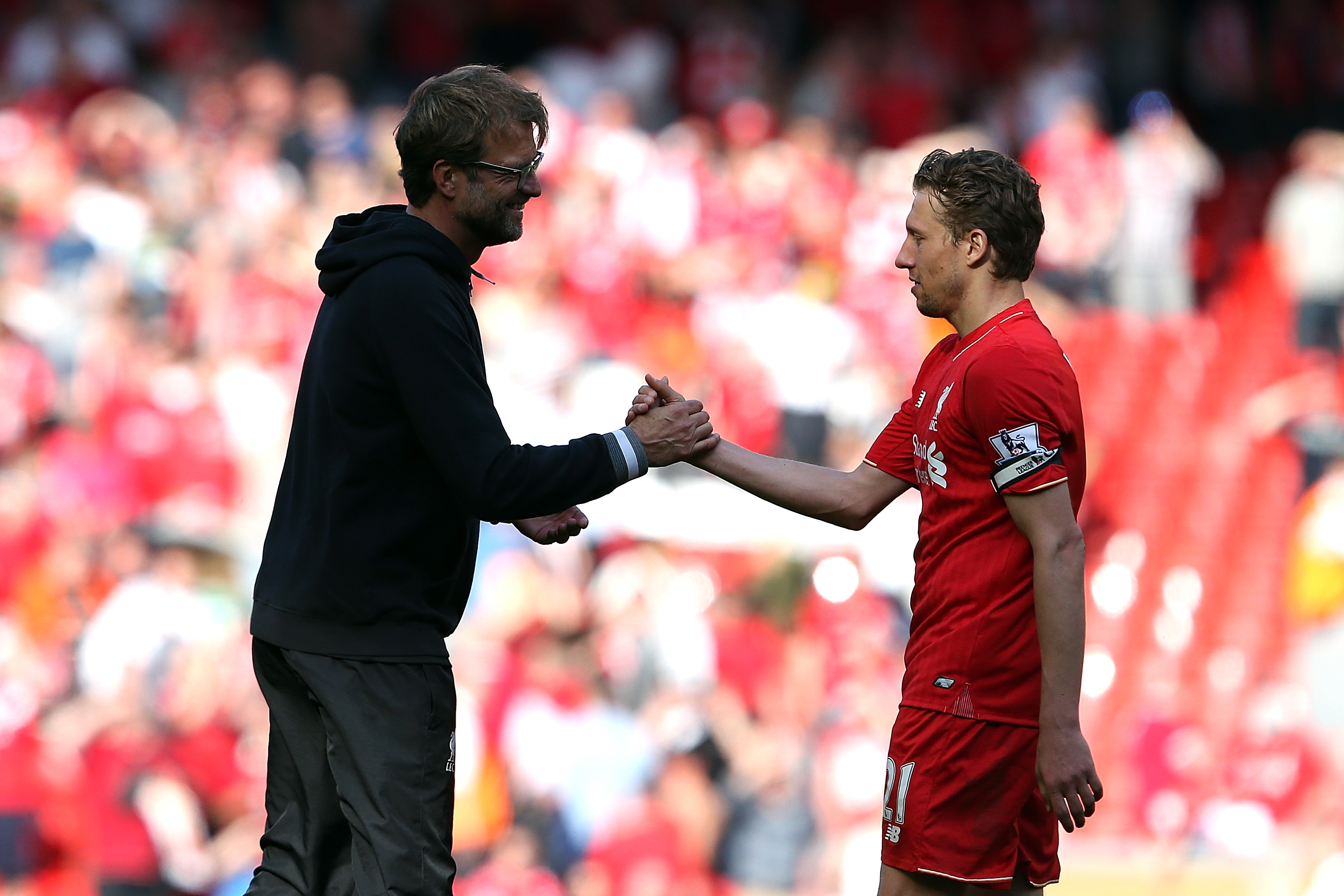 LIVERPOOL, ENGLAND - MAY 08: Jurgen Klopp manager of Liverpool shakes hand with Lucas following the Barclays Premier League match between Liverpool and Watford at Anfield on May 8, 2016 in Liverpool, England.  (Photo by Jan Kruger/Getty Images)