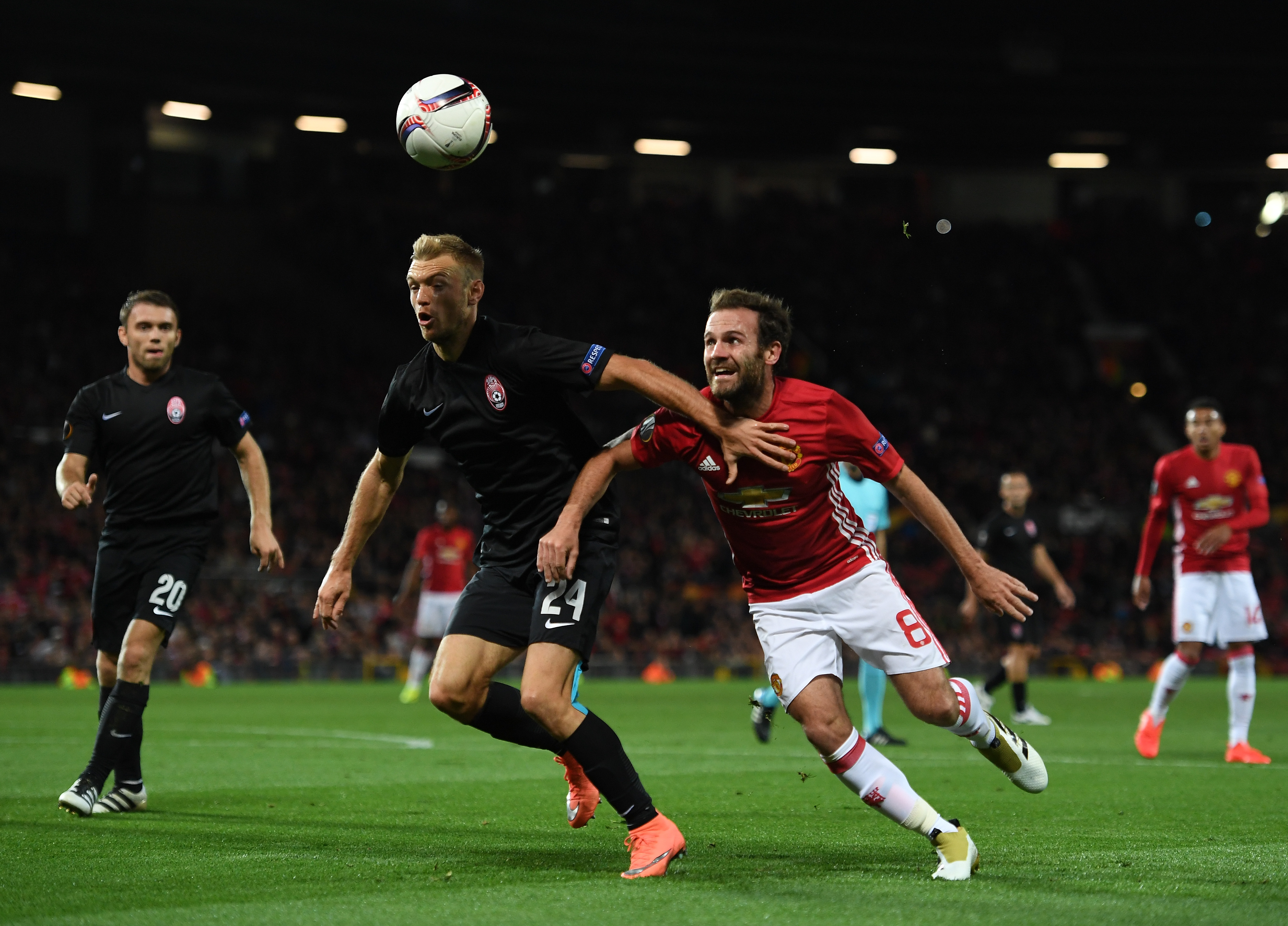 MANCHESTER, ENGLAND - SEPTEMBER 29:  Dmytro Hrechyshkin of Zorya Luhansk and Juan Mata of Manchester United battle for the ball during the UEFA Europa League group A match between Manchester United FC and FC Zorya Luhansk at Old Trafford on September 29, 2016 in Manchester, England.  (Photo by Laurence Griffiths/Getty Images)