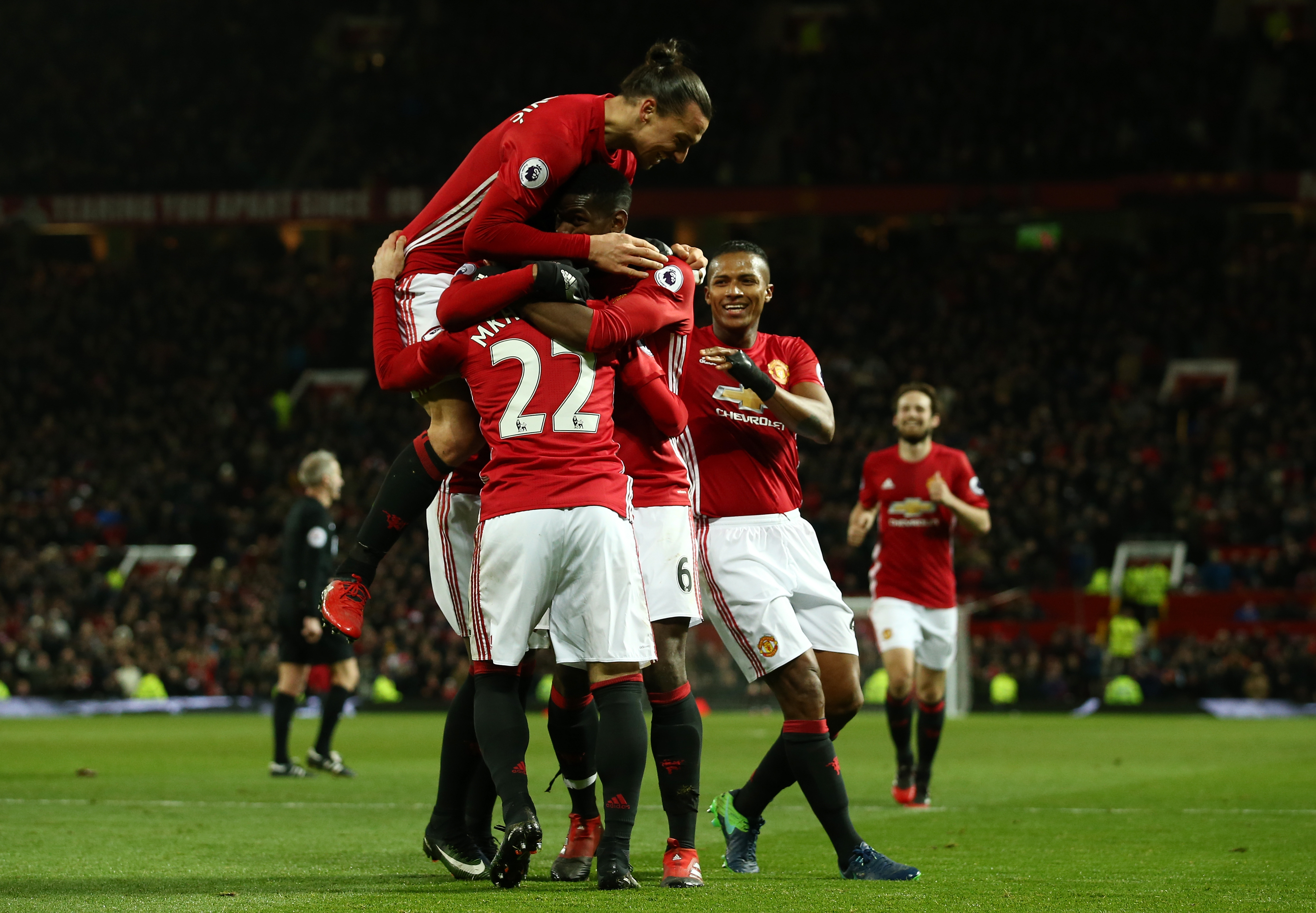 MANCHESTER, ENGLAND - DECEMBER 26:  Henrikh Mkhitaryan #22 of Manchester United celebrates with teammates after scoring his team's third goal during the Premier League match between Manchester United and Sunderland at Old Trafford on December 26, 2016 in Manchester, England.  (Photo by Jan Kruger/Getty Images)