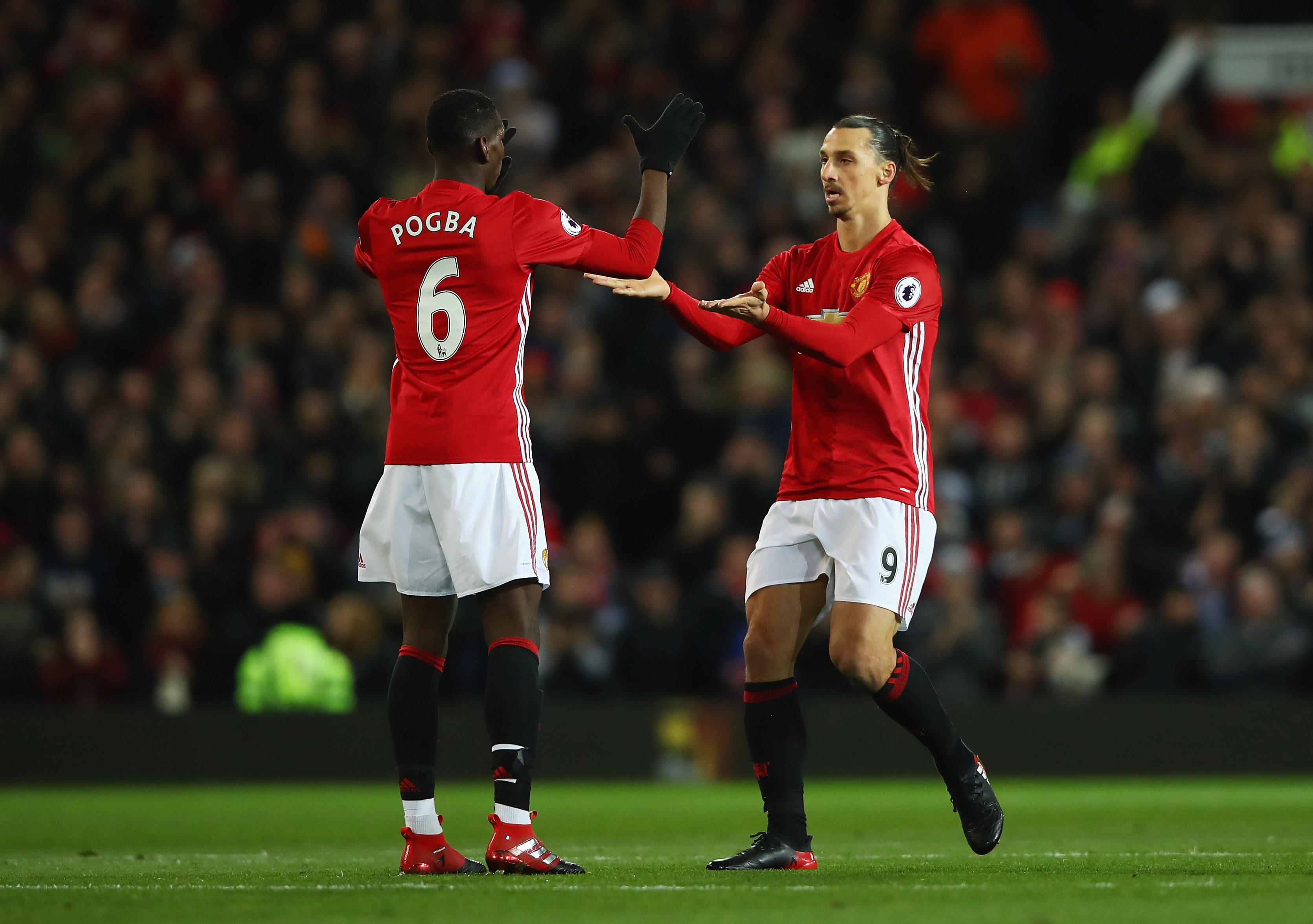 MANCHESTER, ENGLAND - NOVEMBER 27: Zlatan Ibrahimovic of Manchester United (R) celebrates scoring his sides first goal with Paul Pogba of Manchester United (L) during the Premier League match between Manchester United and West Ham United at Old Trafford on November 27, 2016 in Manchester, England.  (Photo by Clive Brunskill/Getty Images)
