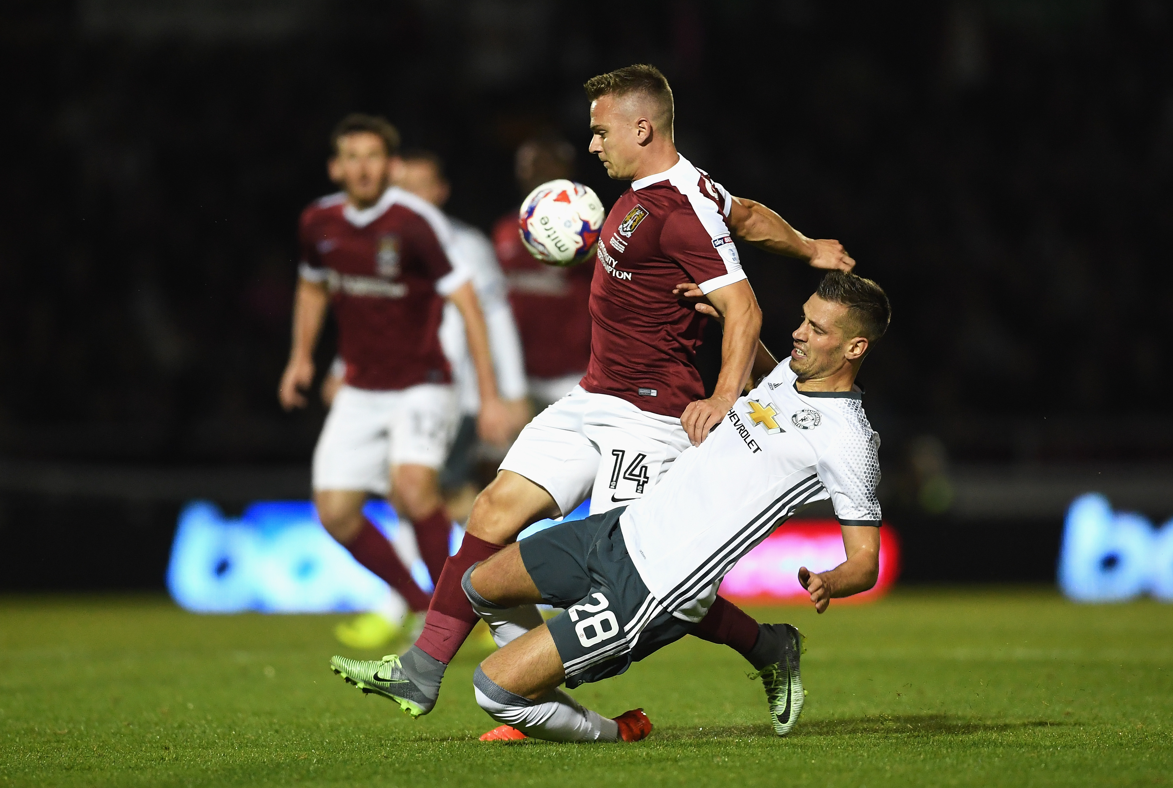 NORTHAMPTON, ENGLAND - SEPTEMBER 21:  Sam Hoskins of Northampton Town is tackled by Morgan Schneiderlin of Manchester United during the  EFL Cup Third Round match between Northampton Town and Manchester United at Sixfields on September 21, 2016 in Northampton, England.  (Photo by Laurence Griffiths/Getty Images)