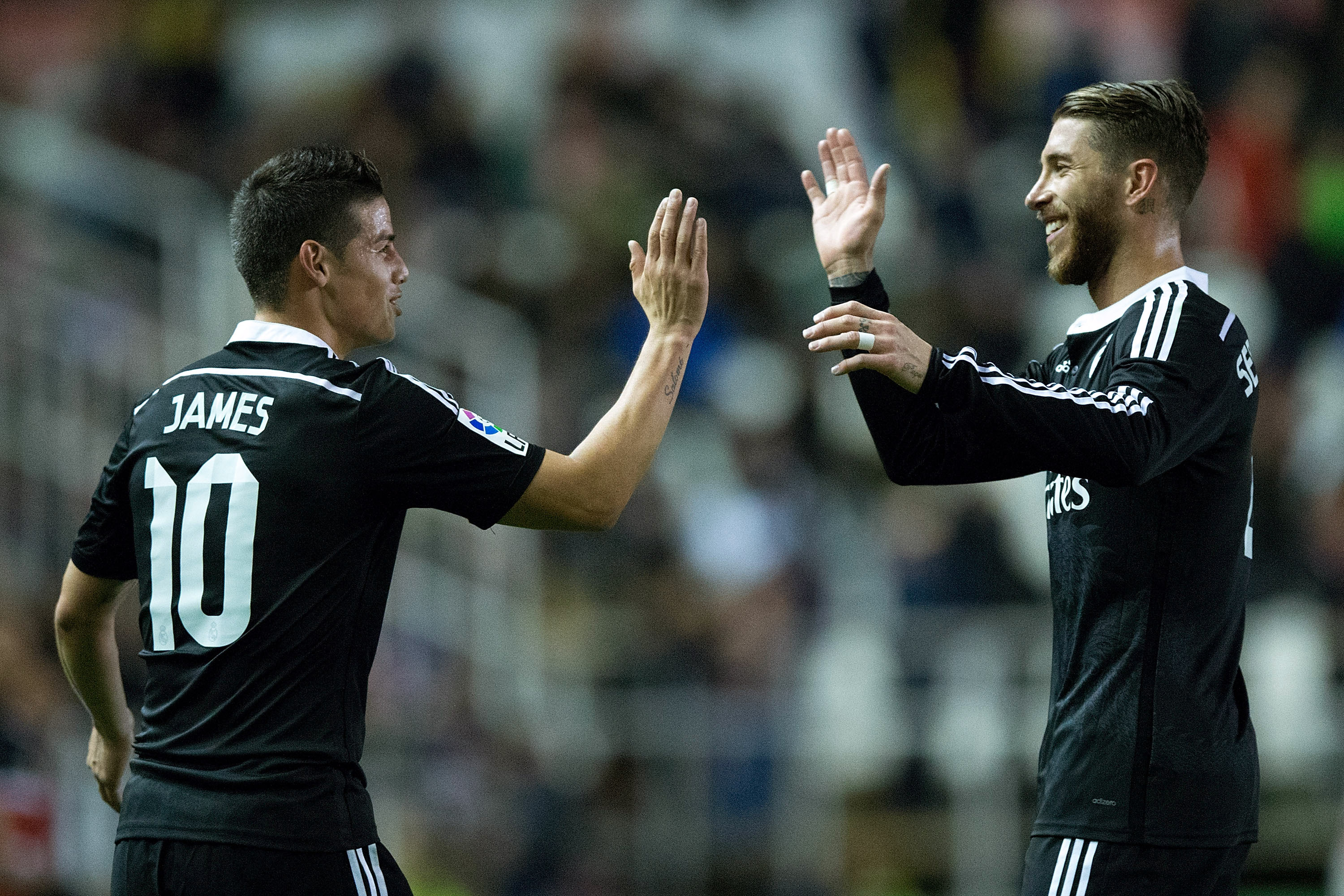 MADRID, SPAIN - APRIL 08:  James Rodriguez (L) of Real Madrid CF celebrates scoring their second goal Sergio Ramos (R) during the La Liga match between Rayo Vallecano de Madrid and Real Madrid CF at Vallecas Stadium on April 8, 2015 in Madrid, Spain.  (Photo by Gonzalo Arroyo Moreno/Getty Images)