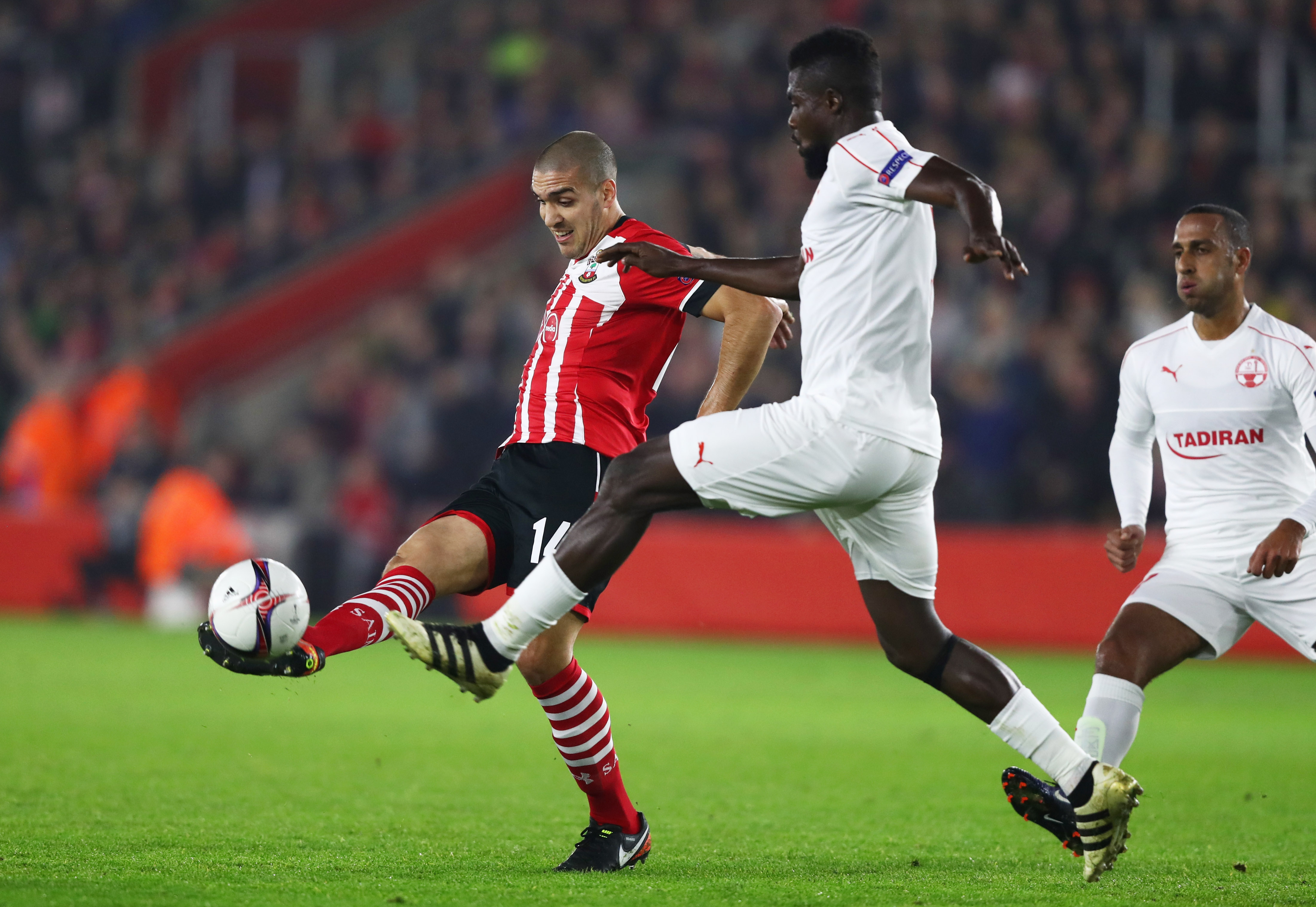 SOUTHAMPTON, ENGLAND - DECEMBER 08:  Oriol Romeu of Southampton and John Ogu of Hapoel Be'er Sheva battle for the ball during the UEFA Europa League Group K match between Southampton FC and Hapoel Be'er-Sheva FC at St Mary's Stadium on December 8, 2016 in Southampton, England.  (Photo by Clive Rose/Getty Images)