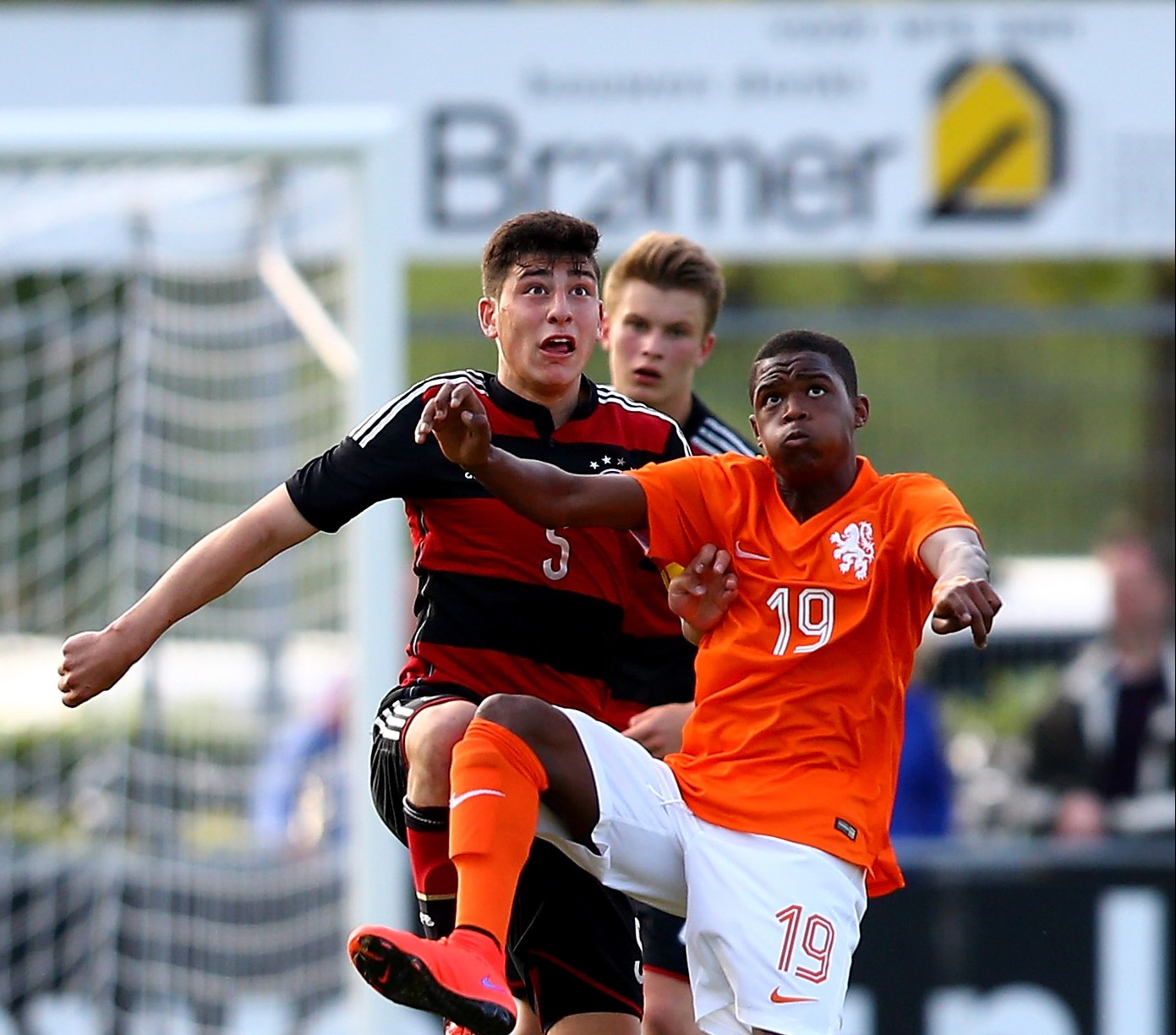 VRIEZENVEEN, NETHERLANDS - MAY 21:  (L-R) Stefano Russo of Germany challenges Daishawn Redan of Netherlands during the international friendly match between U15 Netherlands and U15 Germany at the DETO Twenterand Stadium on May 21, 2015 in Vriezenveen, Netherlands.  (Photo by Christof Koepsel/Bongarts/Getty Images)