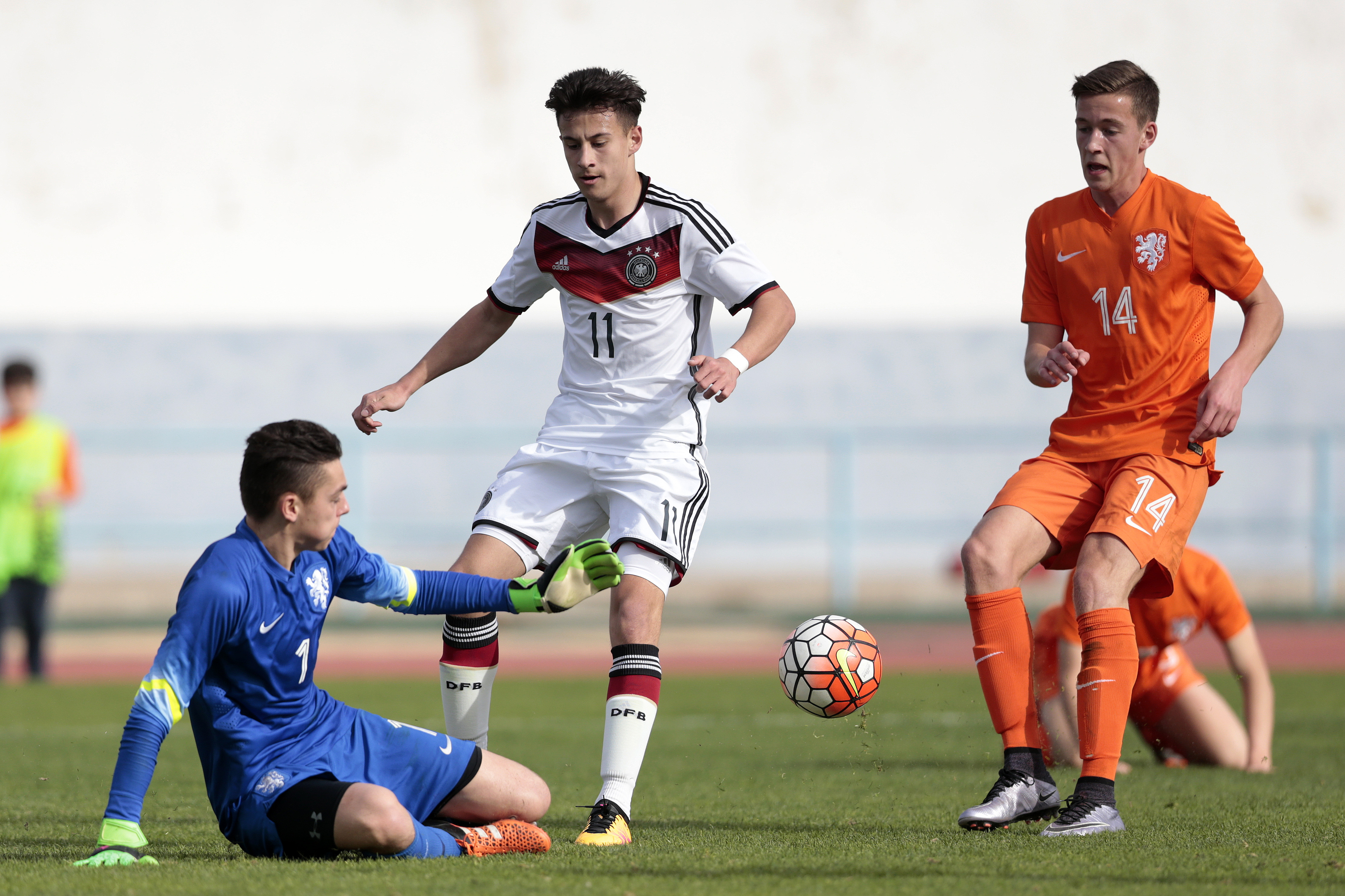 VILA REAL DE SANTO ANTONIO, PORTUGAL  -  FEBRUARY 8: Nicolas-Gerrit Kuhn of Germany challenges Jasper Schendelaar of Netherlands during the UEFA Under16 match between U16 Germany v U16 Netherlands on February 8, 2016 in Vila Real de Santo Antonio, Portugal. (Photo by Filipe Farinha/Bongarts/Getty Images