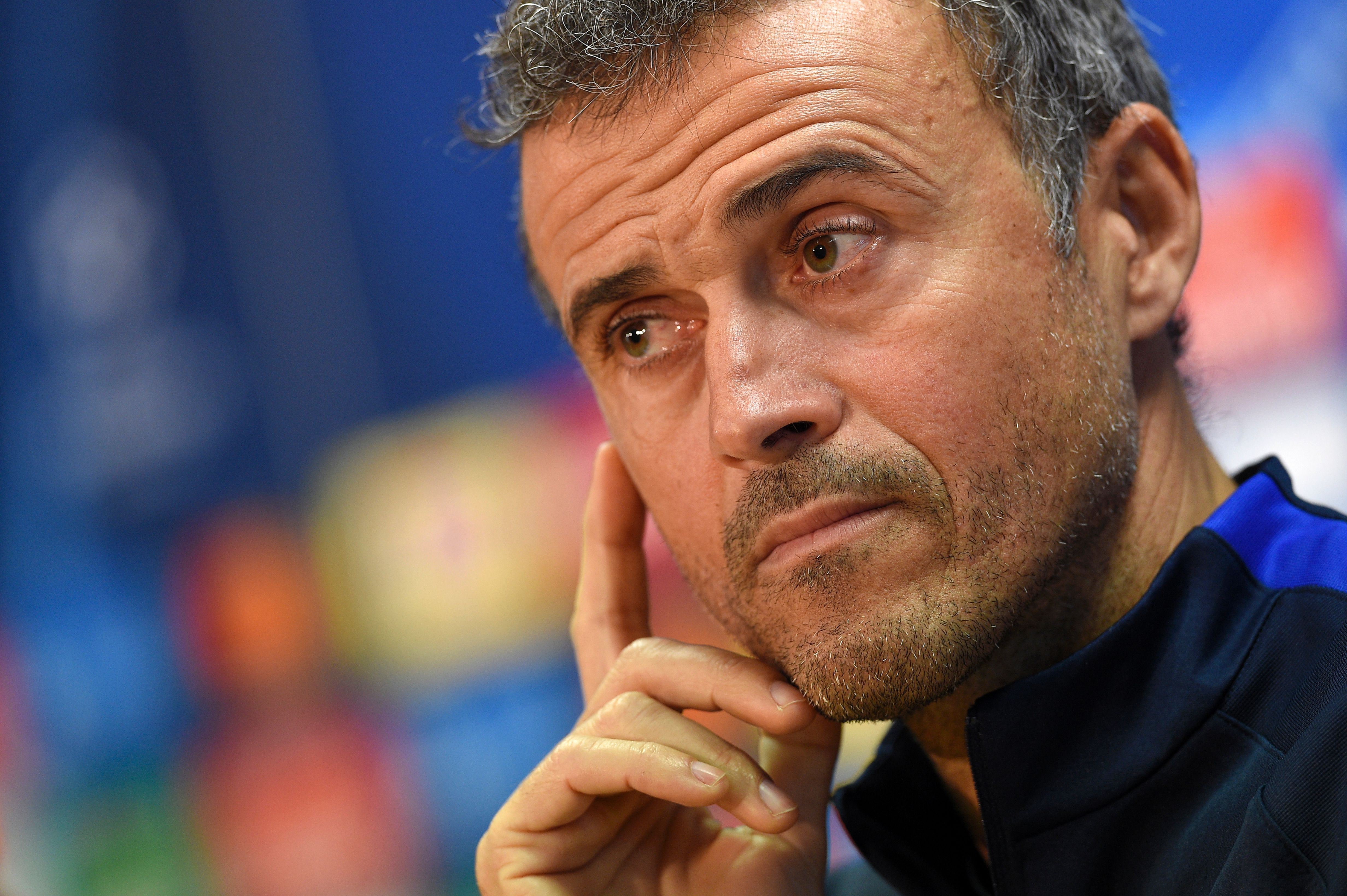 Barcelona's coach Luis Enrique listens to a journalist's question during a press conference at the Sports Center FC Barcelona Joan Gamper in Sant Joan Despi, near Barcelona on December 5, 2016, on the eve of the UEFA Champions League football match FC vs Borussia Moenchengladbach. / AFP / LLUIS GENE        (Photo credit should read LLUIS GENE/AFP/Getty Images)