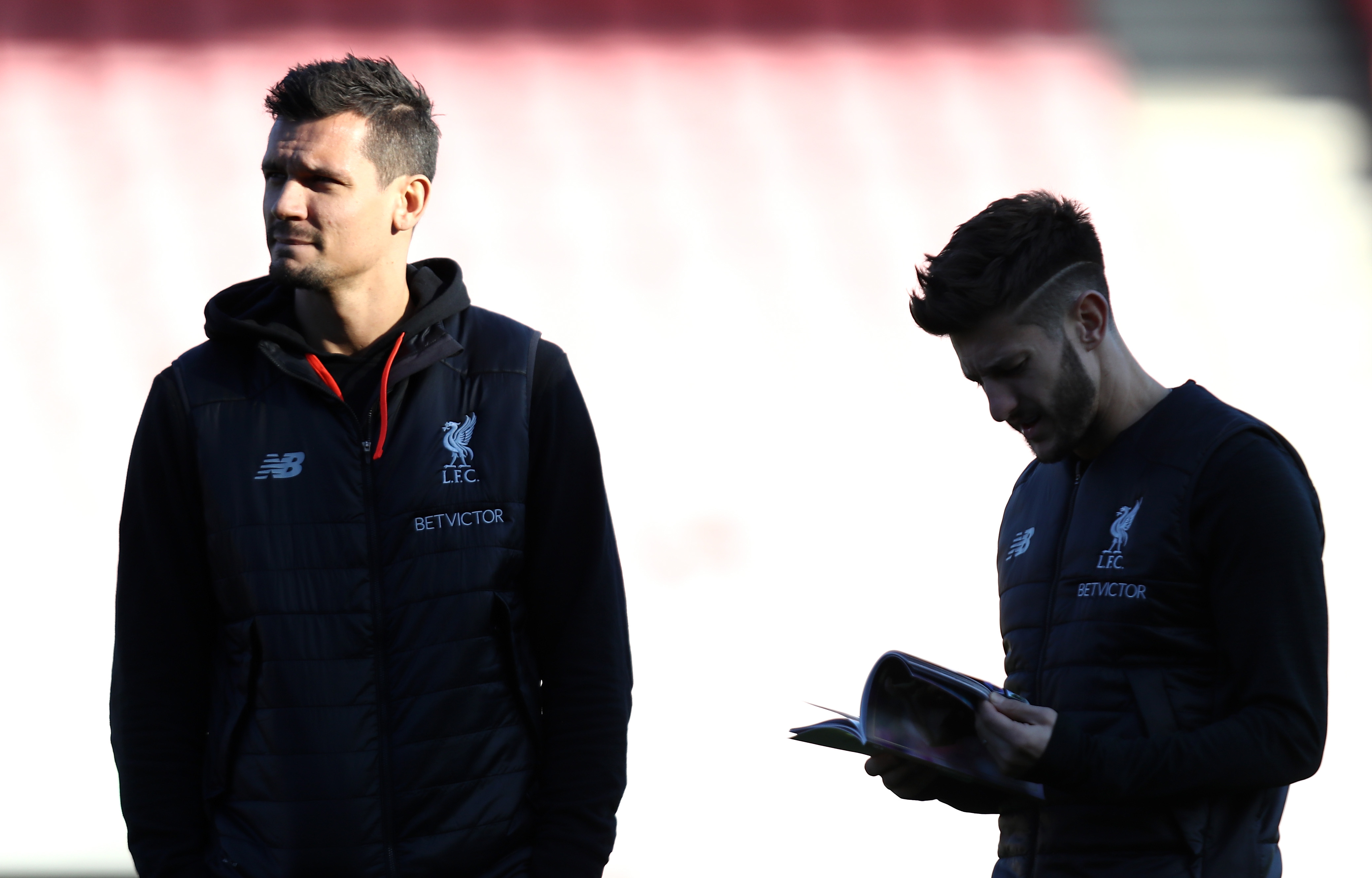 BOURNEMOUTH, ENGLAND - DECEMBER 04:  Dejan Lovren of Liverpool speaks with Adam Lallana of Liverpool during the Premier League match between AFC Bournemouth and Liverpool at Vitality Stadium on December 4, 2016 in Bournemouth, England.  (Photo by Bryn Lennon/Getty Images)