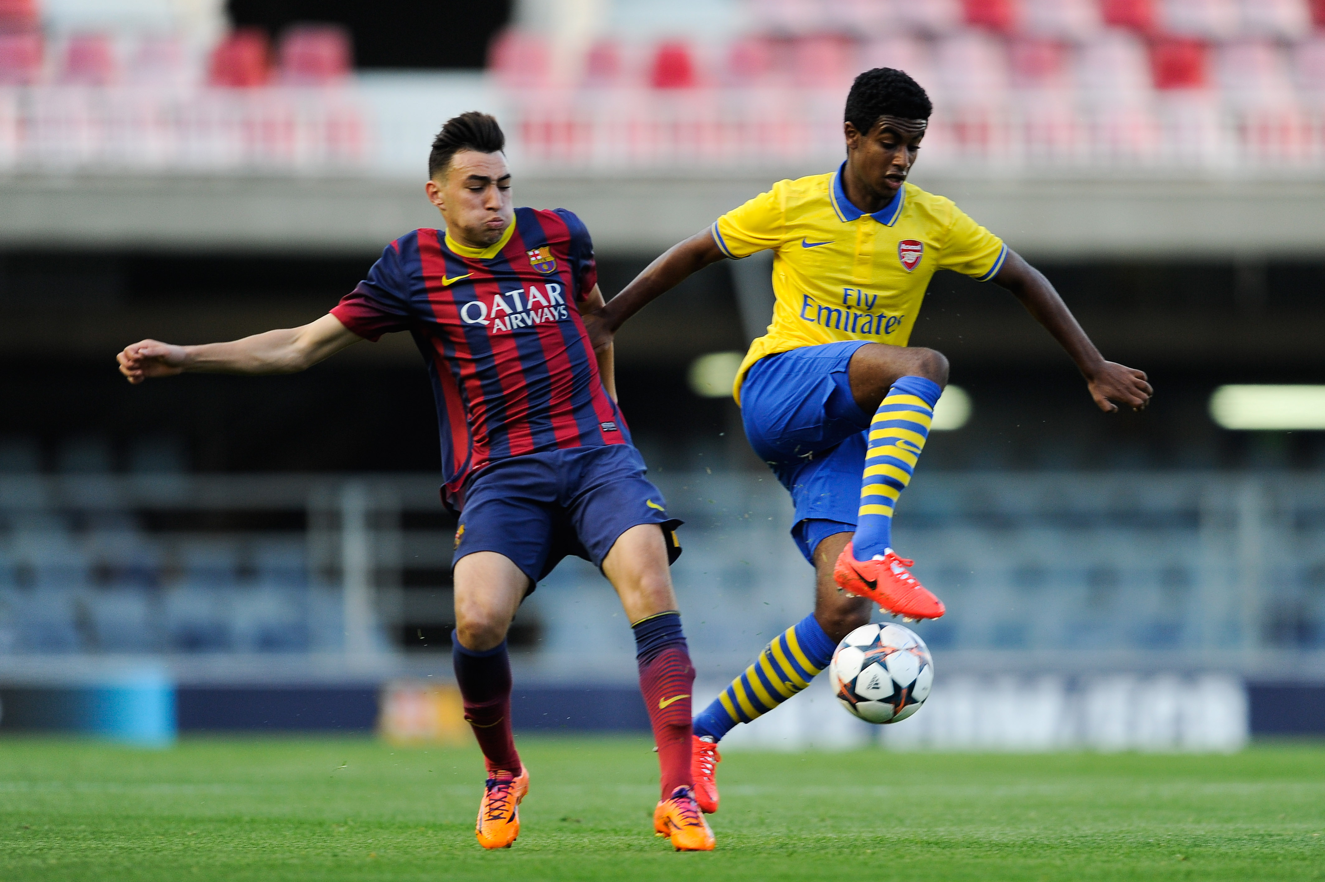 BARCELONA, SPAIN - MARCH 18:  Gedion Zelalem of Arsenal duels for the ball with Munir El Haddadi of FC Barcelona during the UEFA Youth League Quarter FInal match between FC Barcelona U19 and Arsenal U19 at Mini Estadi on March 18, 2014 in Barcelona, Spain.  (Photo by David Ramos/Getty Images)