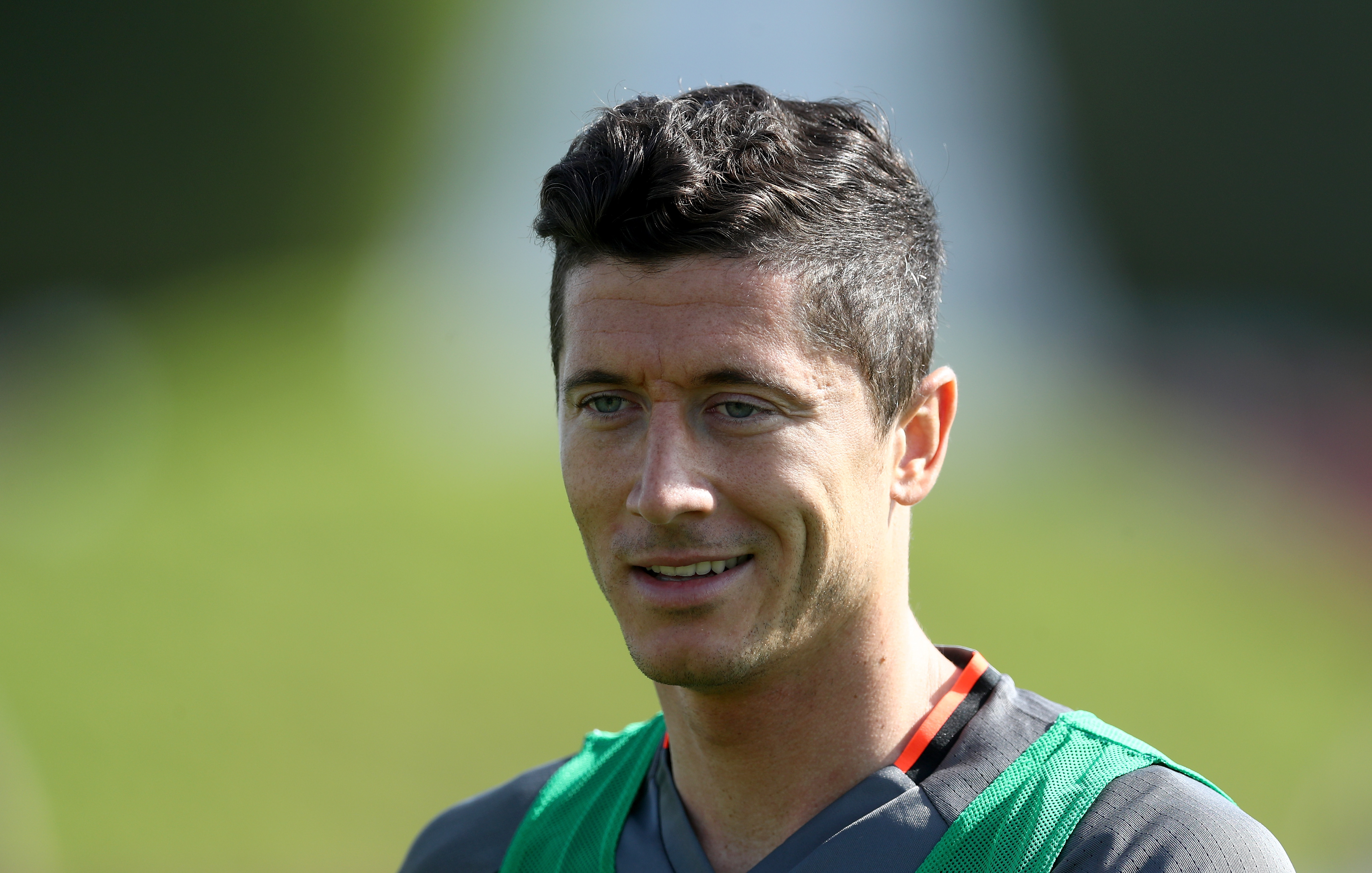 DOHA, QATAR - JANUARY 04:  Robert Lewandowski smiles during a training session at day 2 of the Bayern Muenchen training camp at Aspire Academy on January 4, 2017 in Doha, Qatar.  (Photo by Lars Baron/Bongarts/Getty Images)