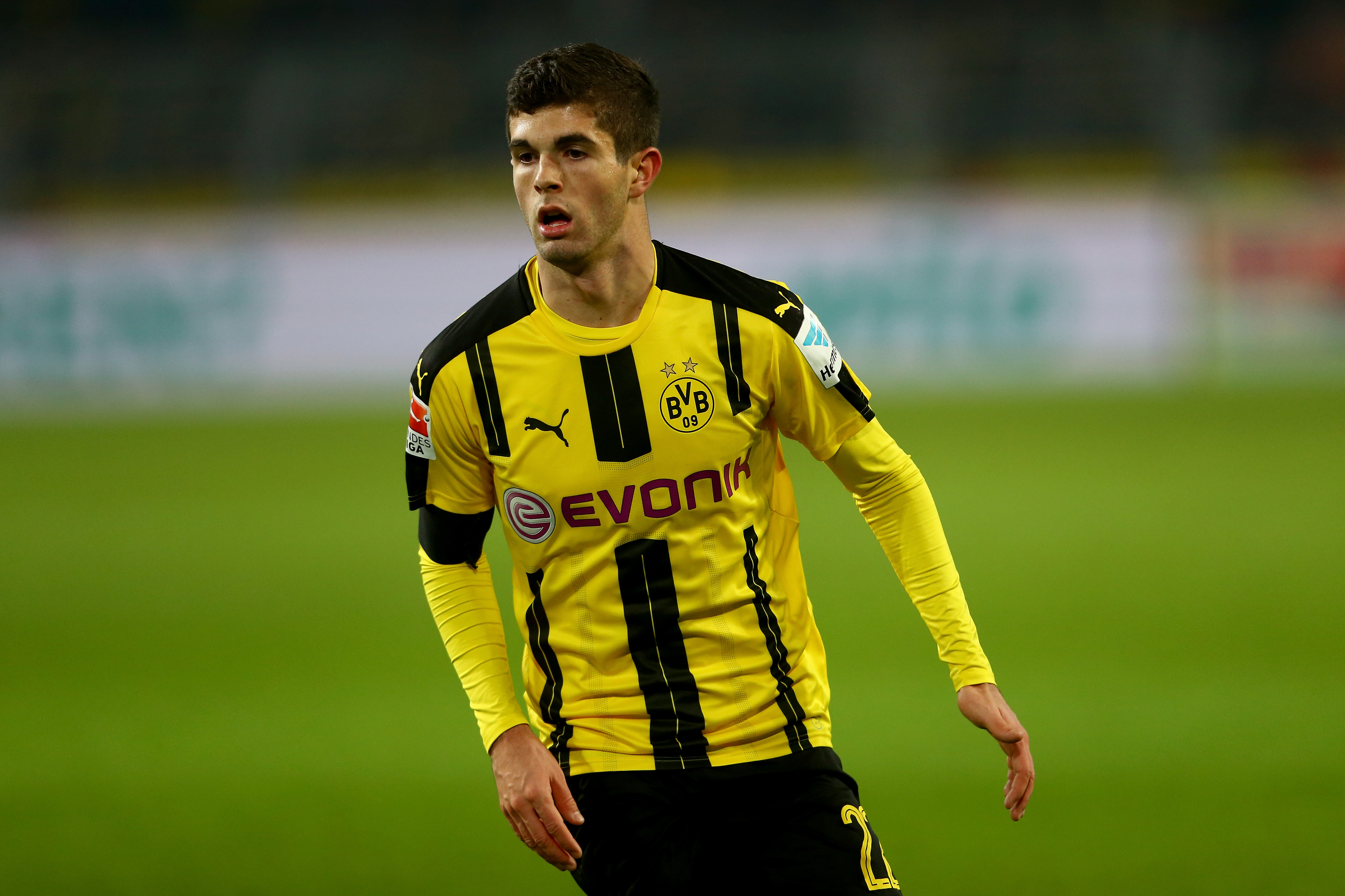 DORTMUND, GERMANY - DECEMBER 03:  Christian Pulisic of Dortmund runs with the ball during the Bundesliga match between Borussia Dortmund and Borussia Moenchengladbach at Signal Iduna Park on December 3, 2016 in Dortmund, Germany.  (Photo by Christof Koepsel/Bongarts/Getty Images)