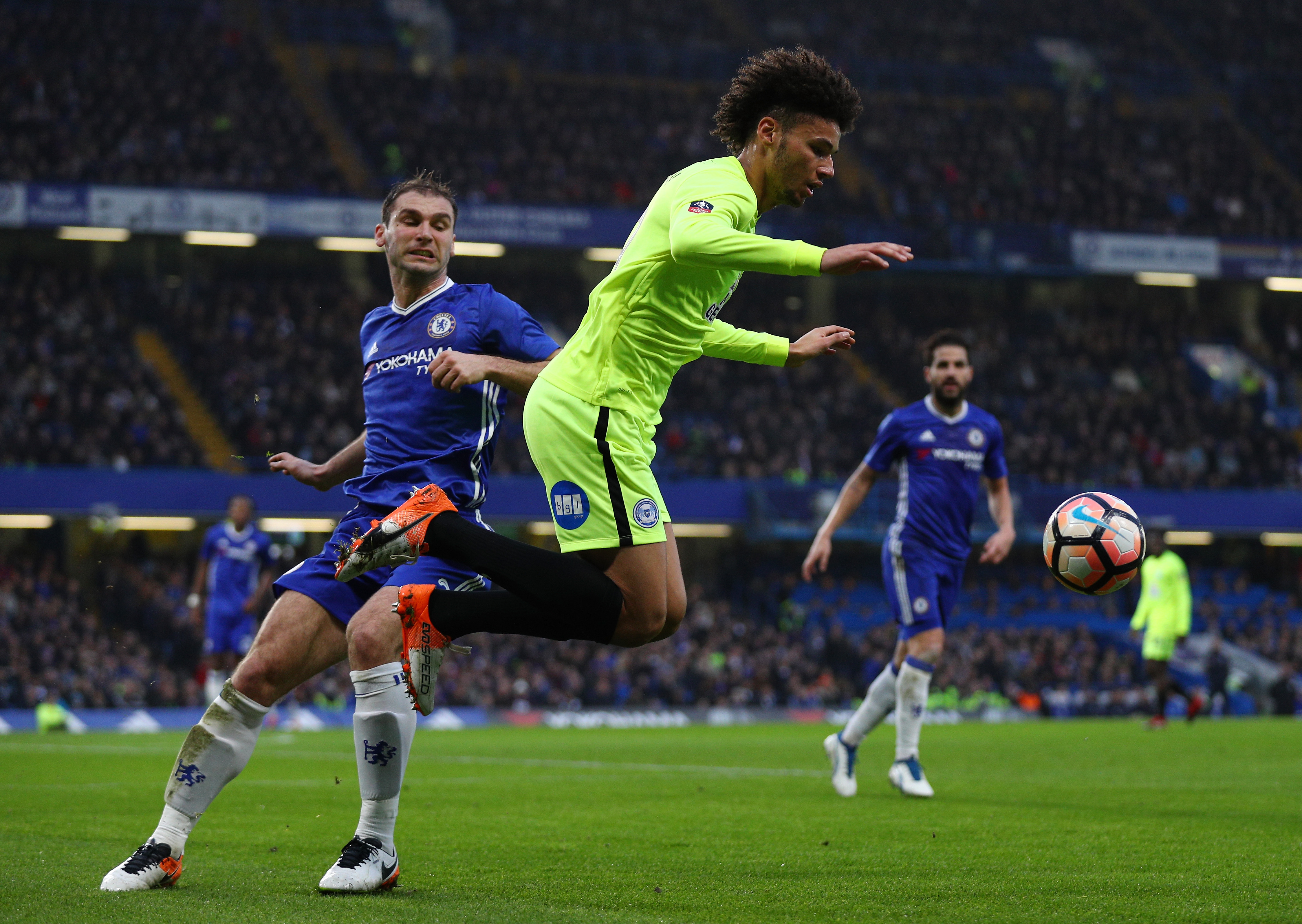 LONDON, ENGLAND - JANUARY 08: Branislav Ivanovic of Chelsea (L) fouls Lee Angol of Peterborough United (R) during The Emirates FA Cup Third Round match between Chelsea and Peterborough United at Stamford Bridge on January 8, 2017 in London, England.  (Photo by Ian Walton/Getty Images)