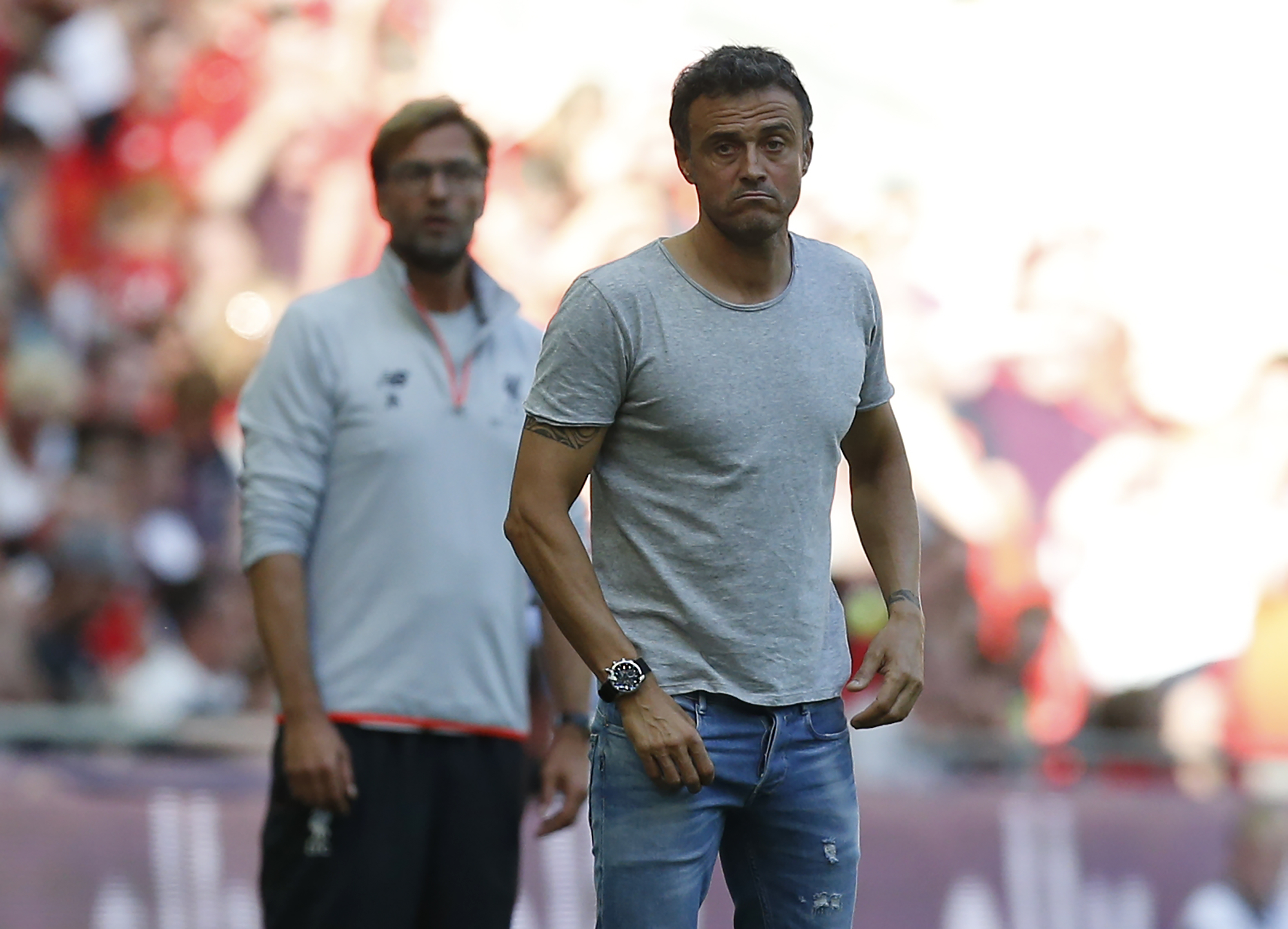 Barcelona's coach Luis Enrique (R) and Liverpool's German manager Jurgen Klopp watch from the touchline during the pre-season International Champions Cup football match between Spanish champions, Barcelona and Liverpool at Wembley stadium in London on August 6, 2016. / AFP / Ian KINGTON        (Photo credit should read IAN KINGTON/AFP/Getty Images)