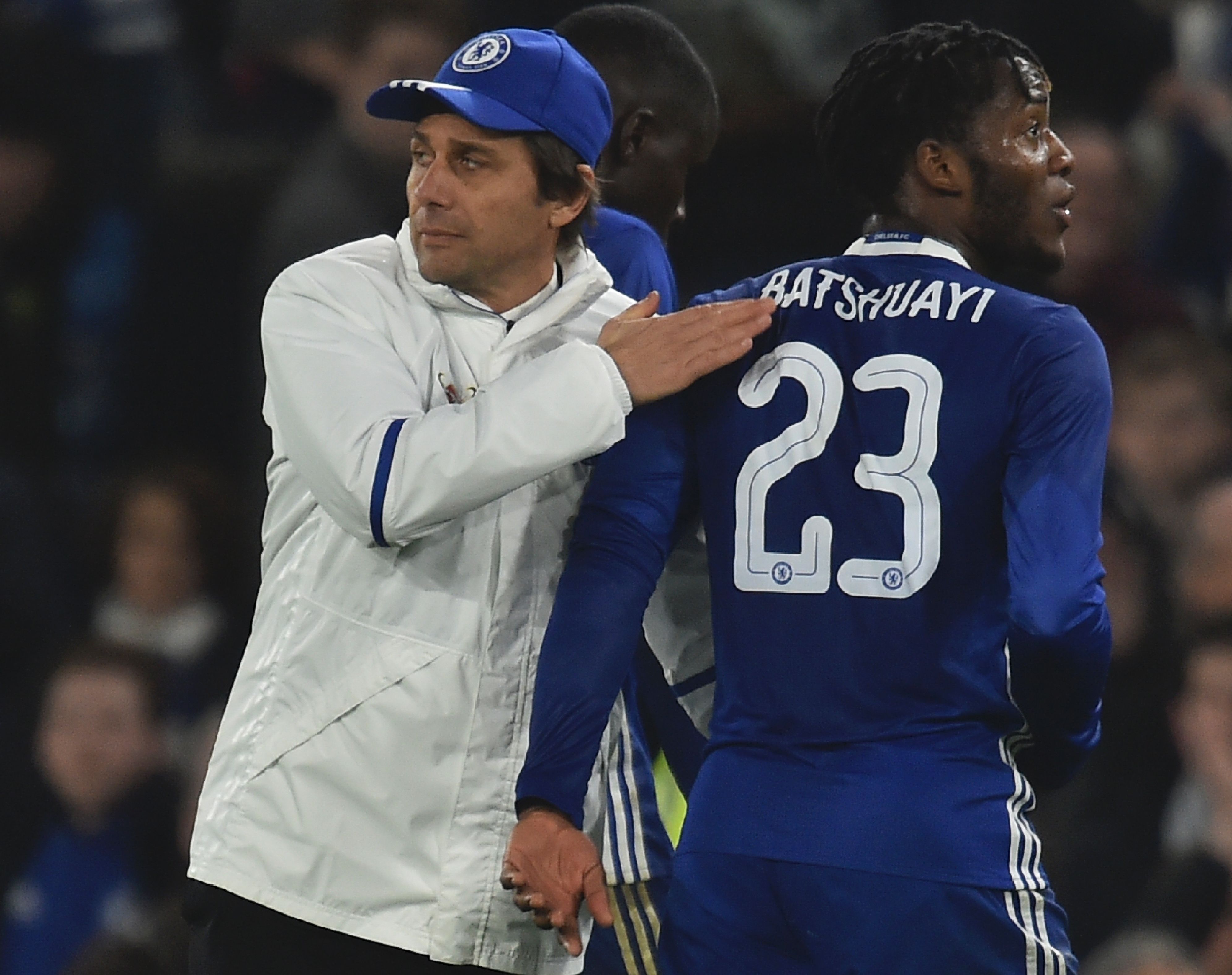 Chelsea's Italian head coach Antonio Conte (L) pats Chelsea's Belgian striker Michy Batshuayi (R) on the back at the end of the English FA Cup third round football match between Chelsea and Peterborough at Stamford Bridge in London on January 8, 2017. (Photo by Glyn Kirk/AFP/Getty Images)